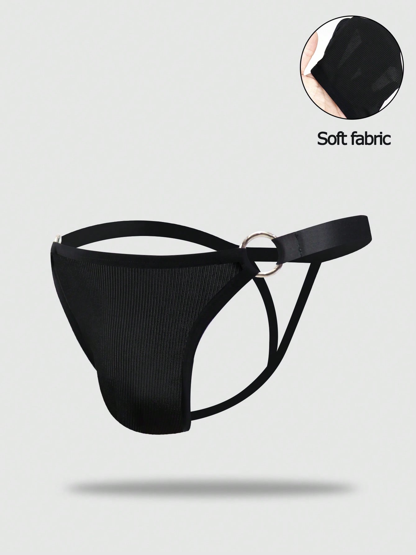 Men's black low rise thong briefs with cut out detail, plain pattern, and medium stretch knitted fabric