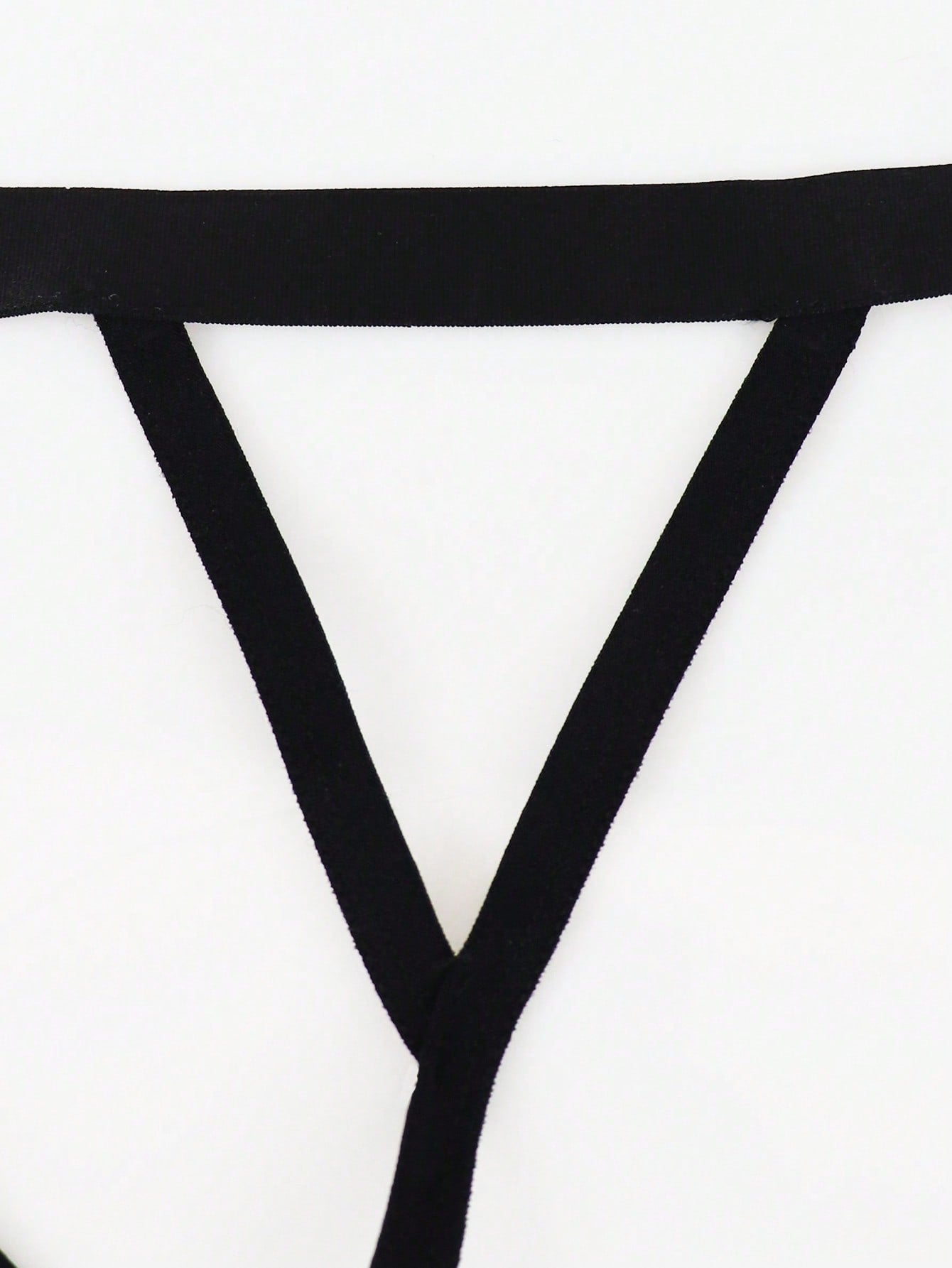 Men's black low rise thong briefs with cut out detail, plain pattern, and medium stretch knitted fabric