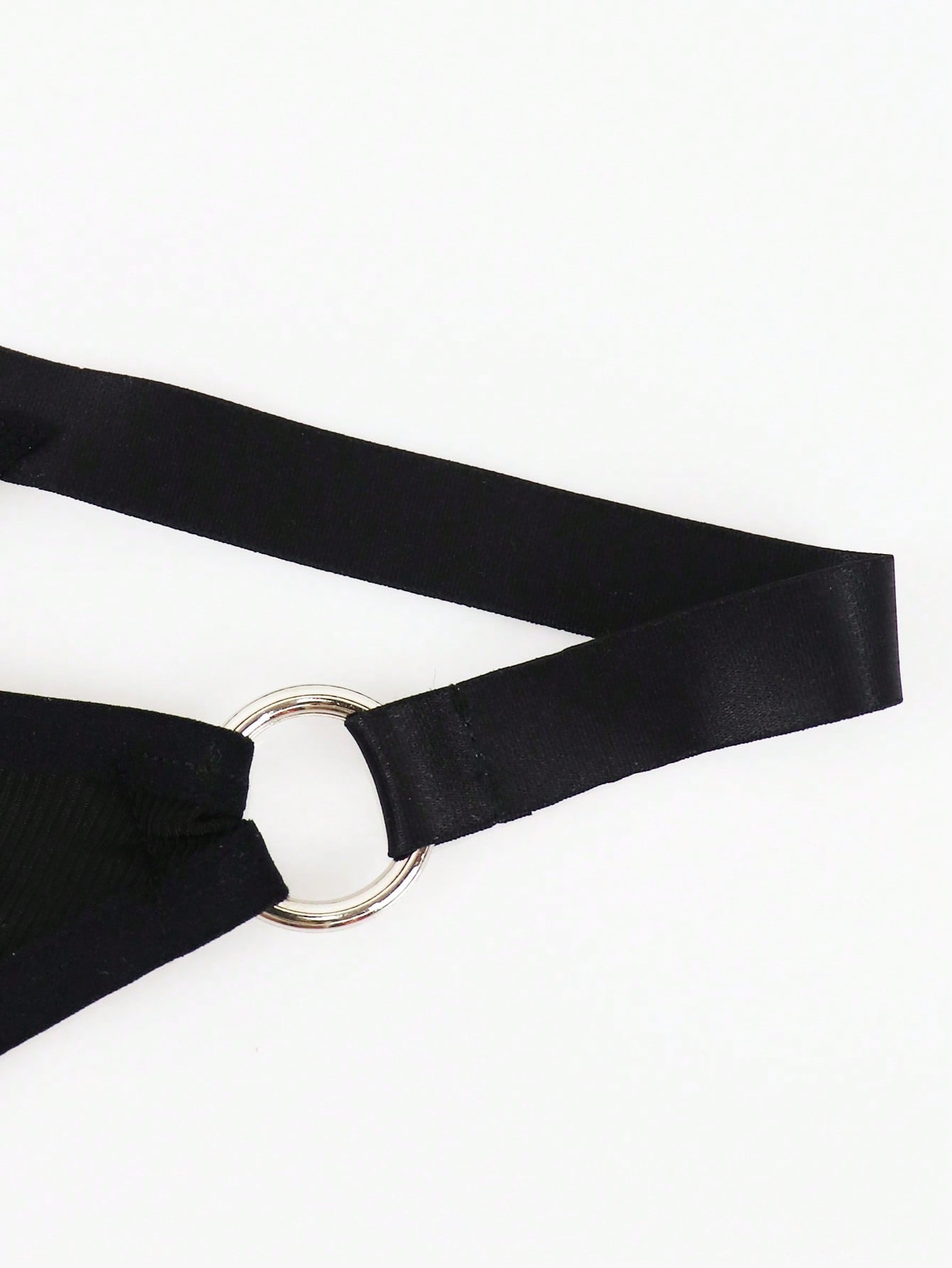 Men's black low rise thong briefs with cut out detail, plain pattern, and medium stretch knitted fabric
