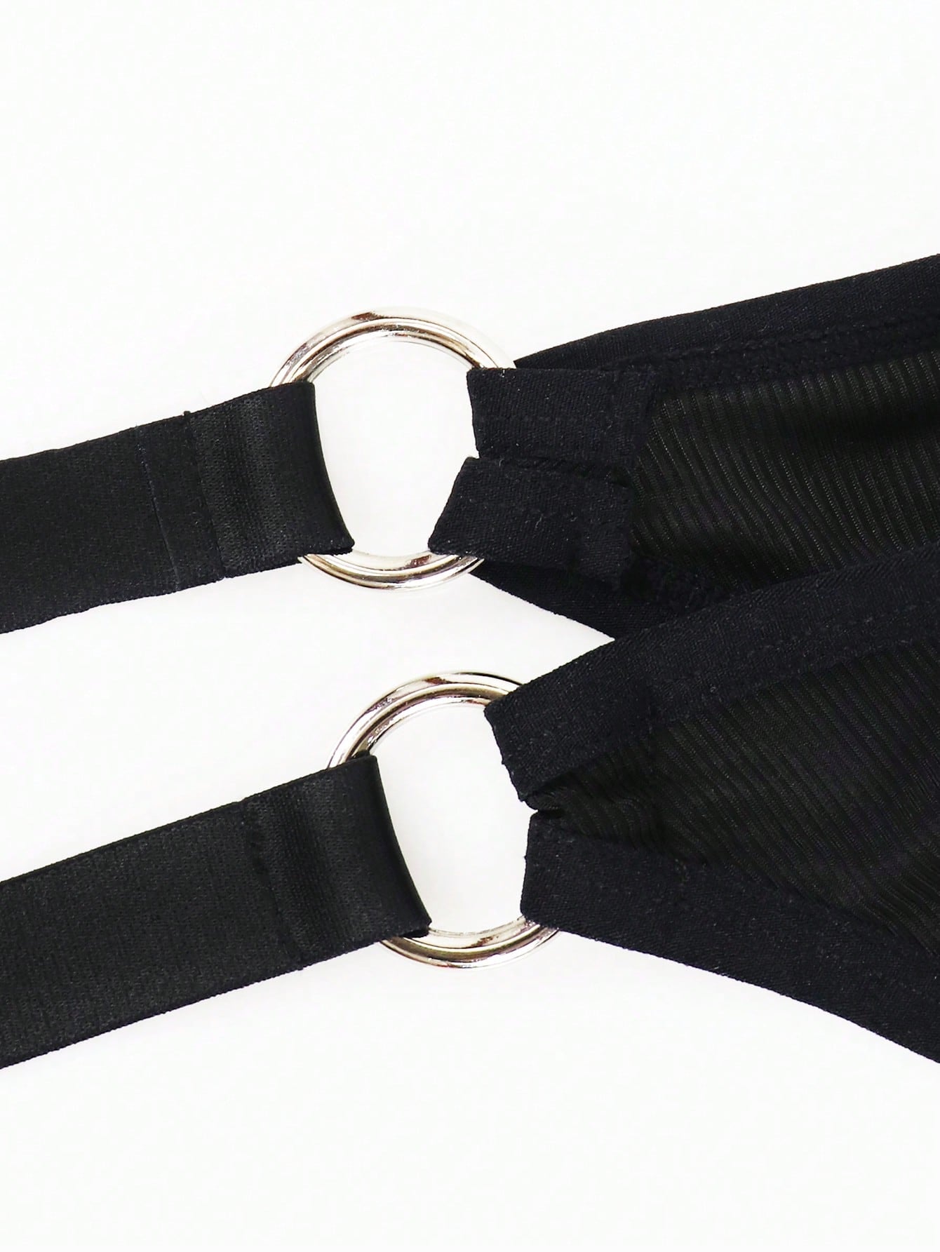 Men's black low rise thong briefs with cut out detail, plain pattern, and medium stretch knitted fabric