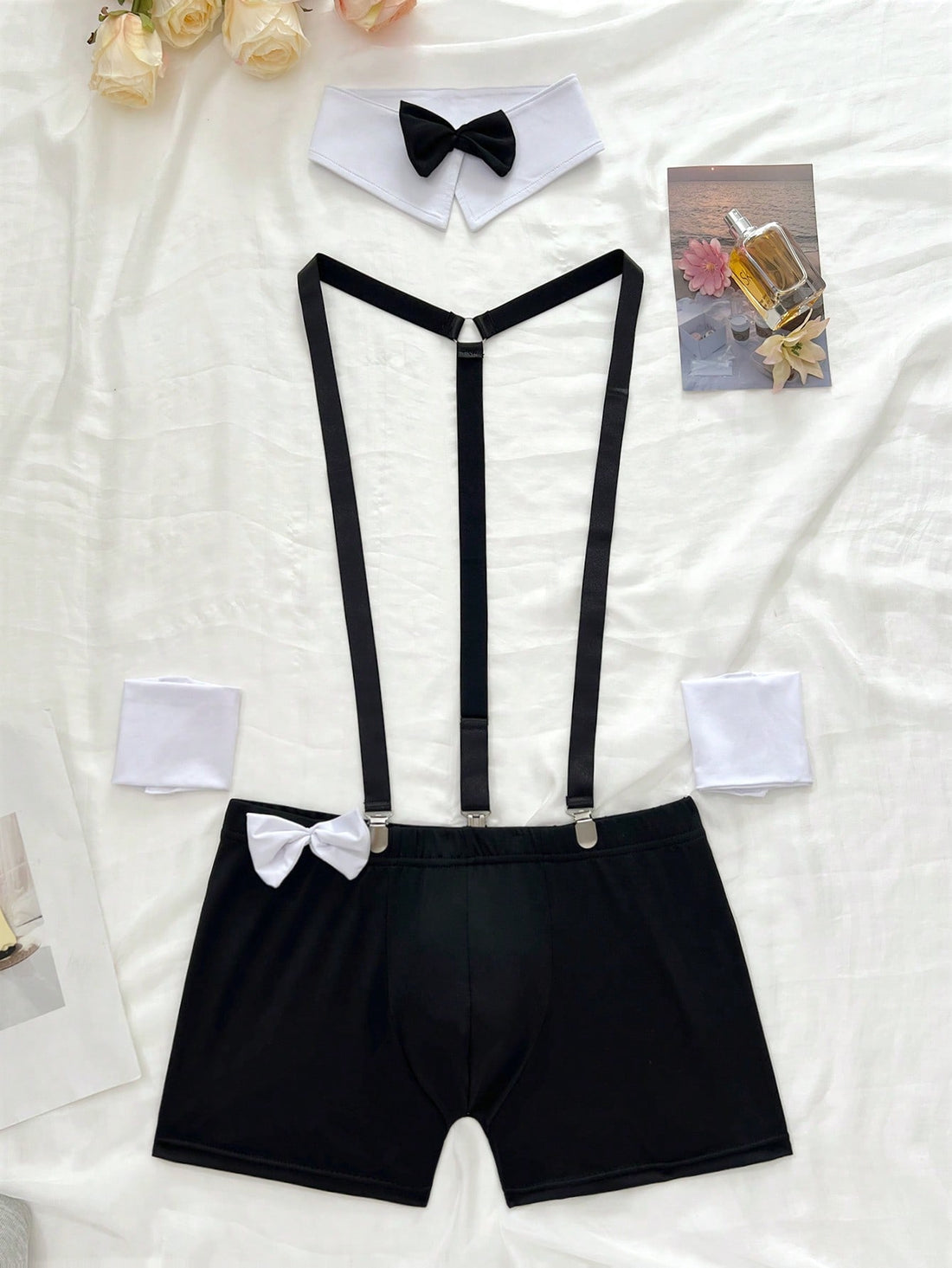 Men's 2-piece costume set with bow decor, contrast lace, geometric pattern, slim fit shorts, and medium-stretch knitted fabric.