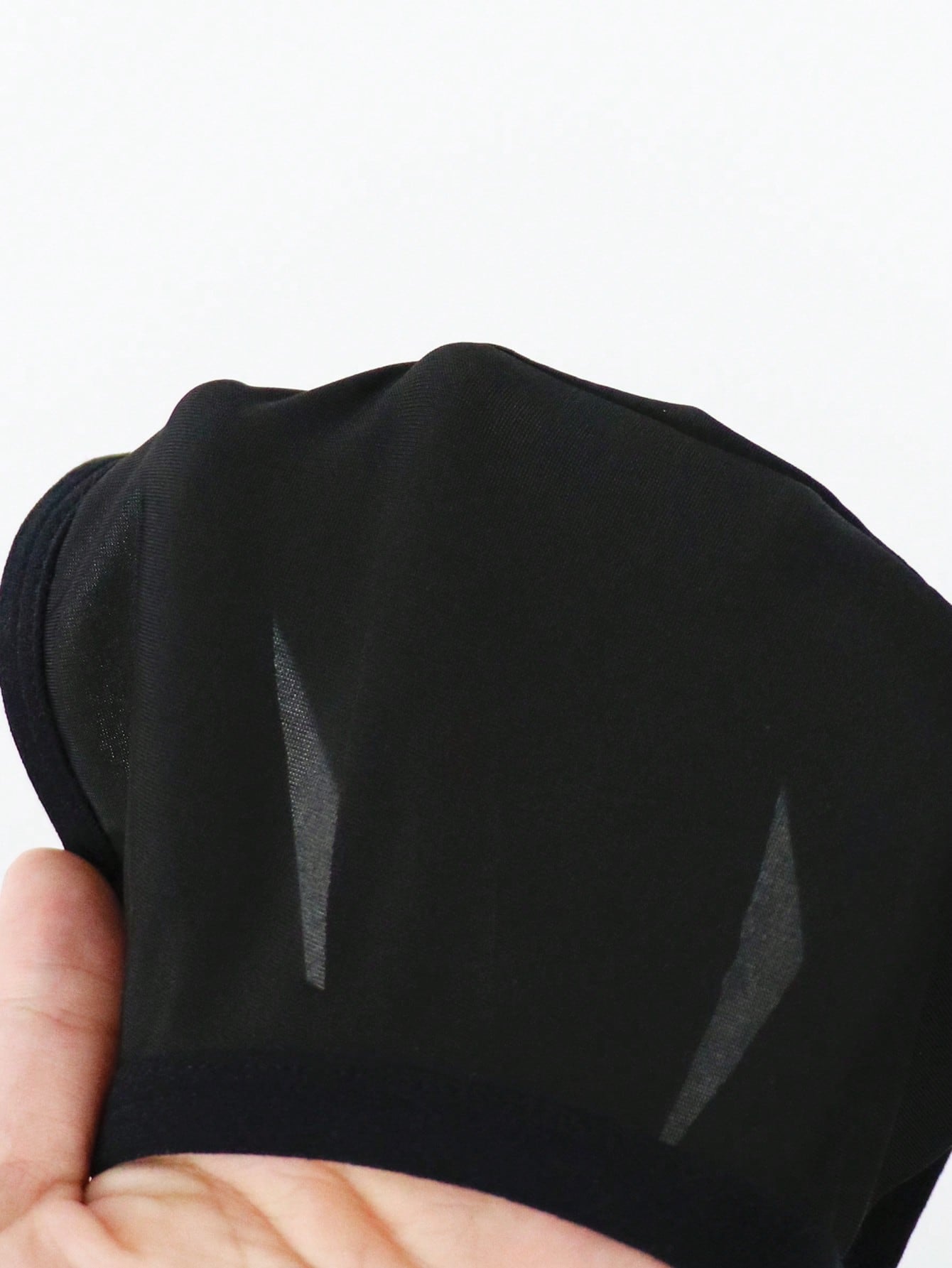 Men's solid color jockstrap underwear in knitted fabric with a breathable hollow design, low rise fit, plain pattern, and medium stretch for daily wear.
