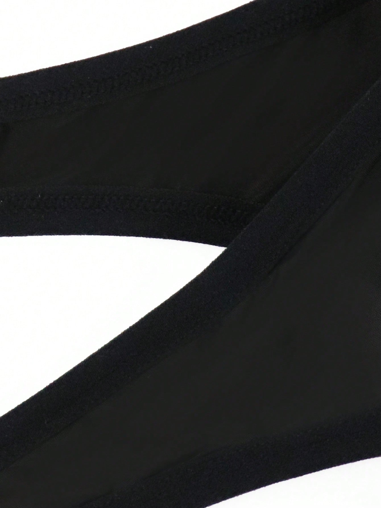 Men's solid color jockstrap underwear in knitted fabric with a breathable hollow design, low rise fit, plain pattern, and medium stretch for daily wear.