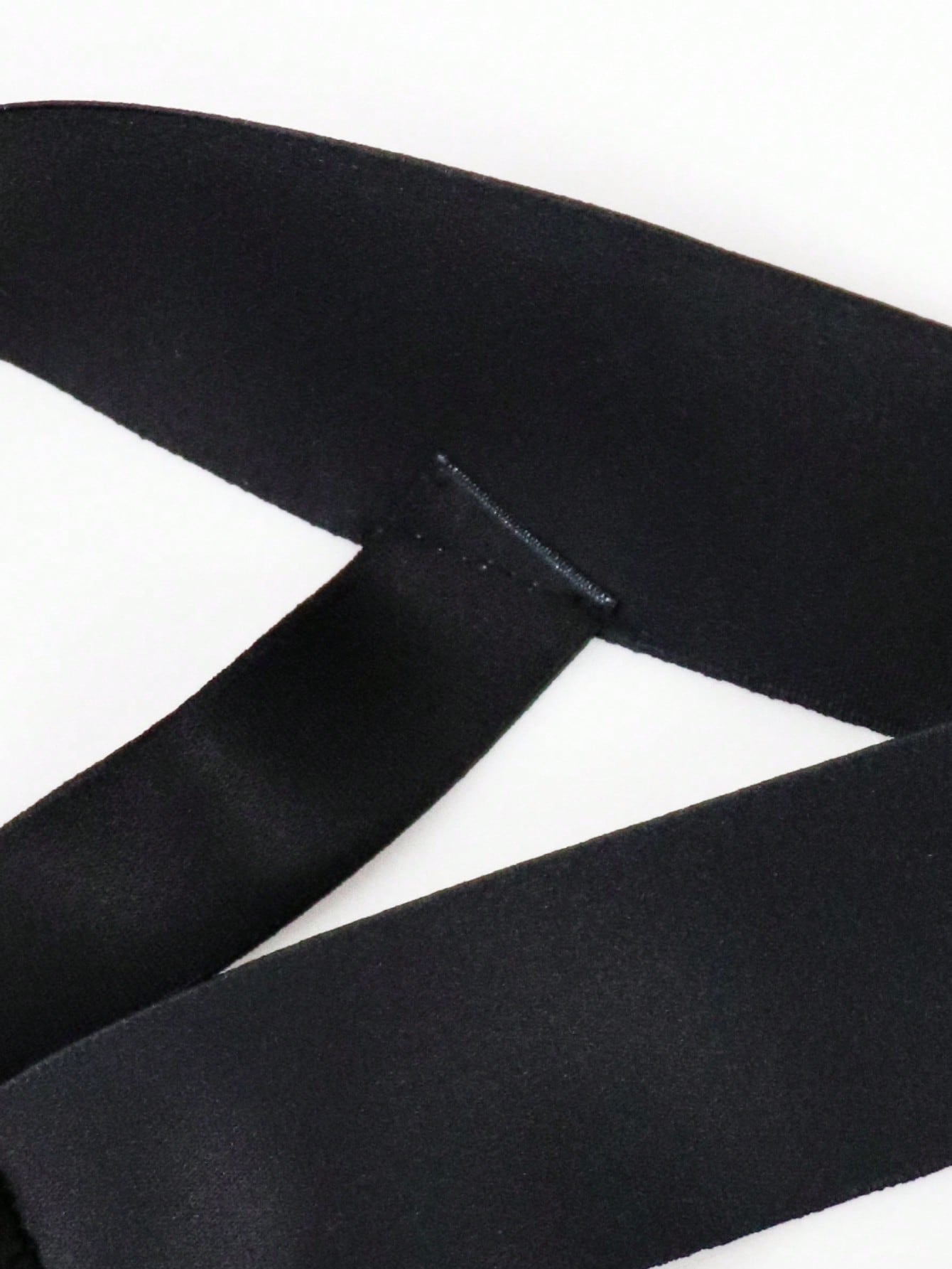 Men's solid color jockstrap underwear in knitted fabric with a breathable hollow design, low rise fit, plain pattern, and medium stretch for daily wear.