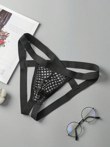 Black men's low rise thong underwear in semi-sheer mesh tulle with geometric pattern and criss cross cut-out detail.