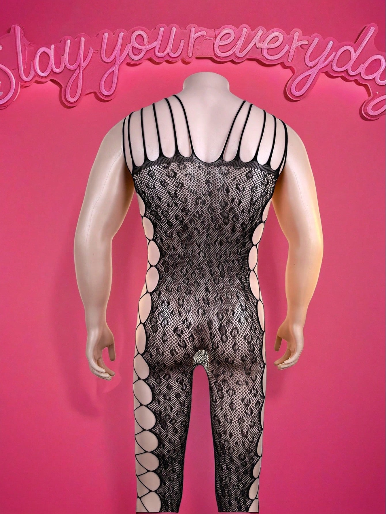 Black men's bodysuit with sheer cut-out design, short length, mid rise, and high-stretch polyamide elastane fabric for party, festival, and costume wear.