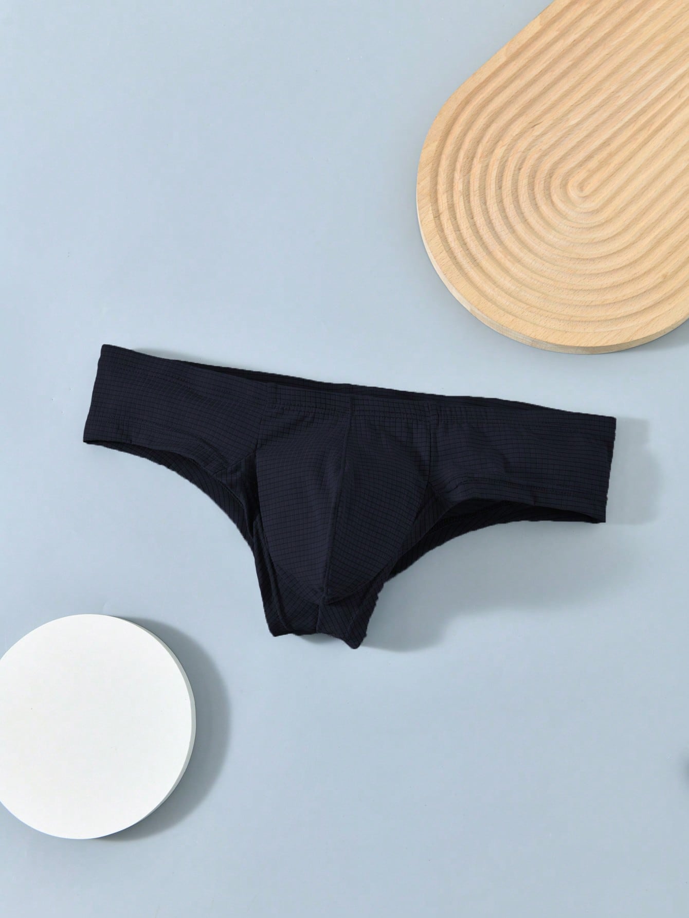 Men's soft thong underwear with low rise fit, plain design, and T-back style in polyester elastane fabric