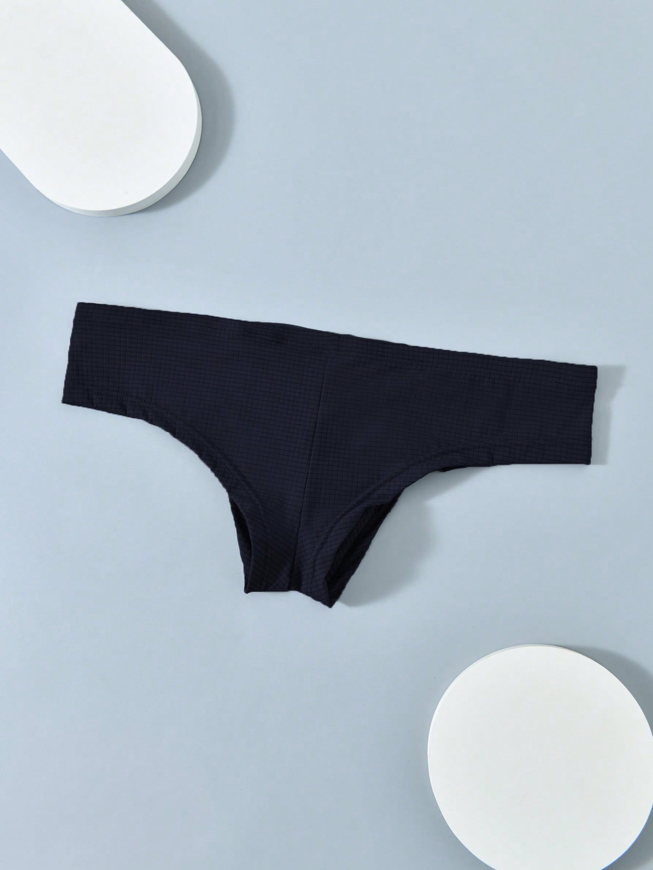 Men's soft thong underwear with low rise fit, plain design, and T-back style in polyester elastane fabric