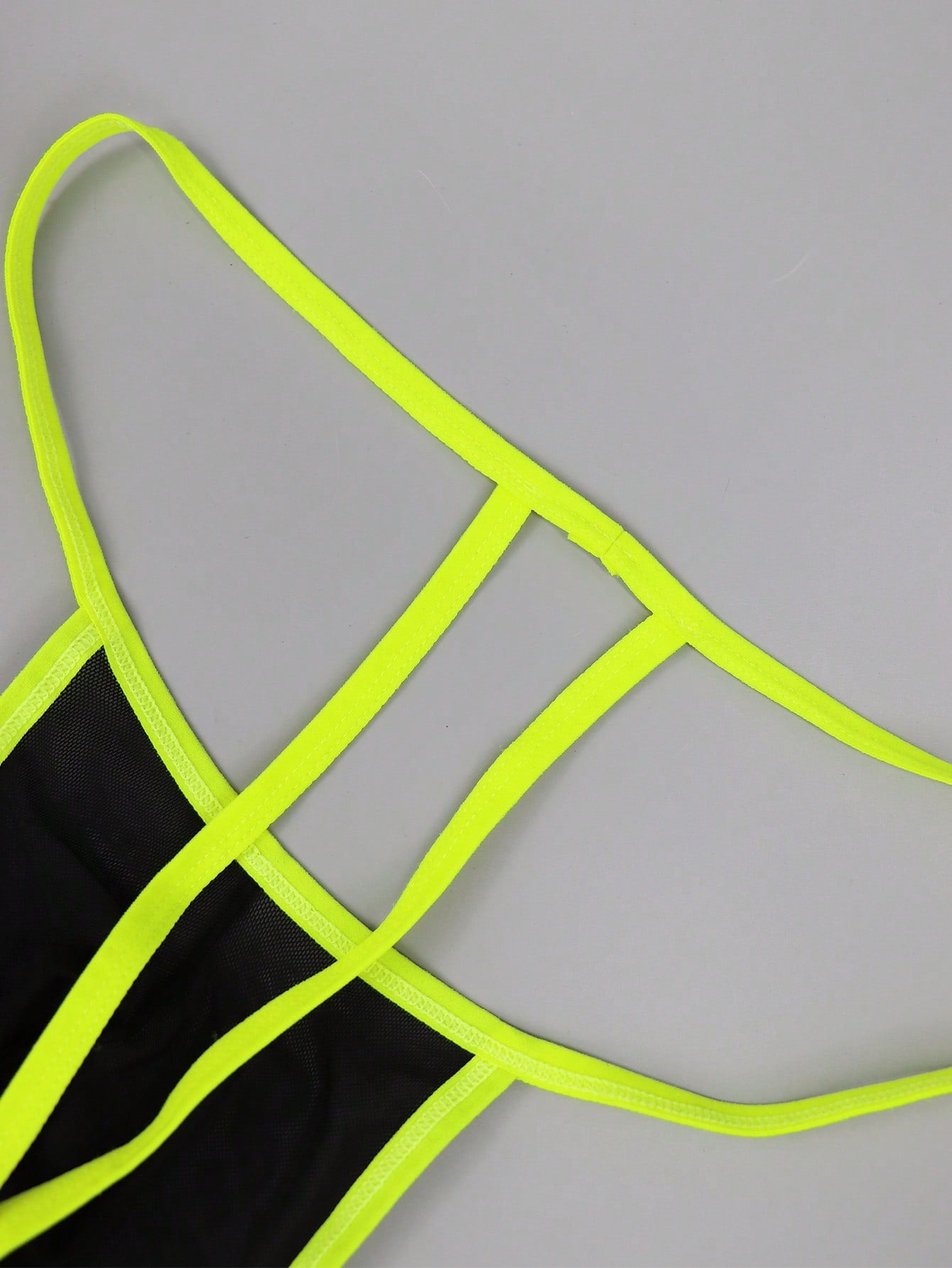 Men's black mesh jockstrap underwear with a plain design, U-convex pouch, and mid-rise fit.