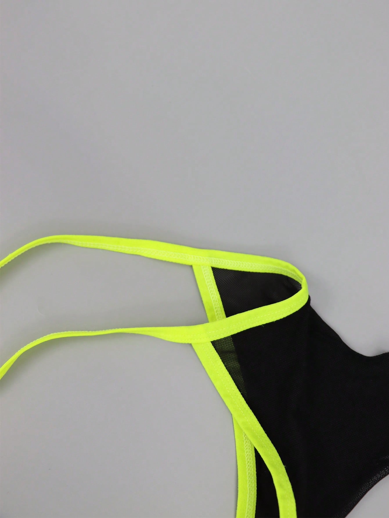 Men's black mesh jockstrap underwear with a plain design, U-convex pouch, and mid-rise fit.