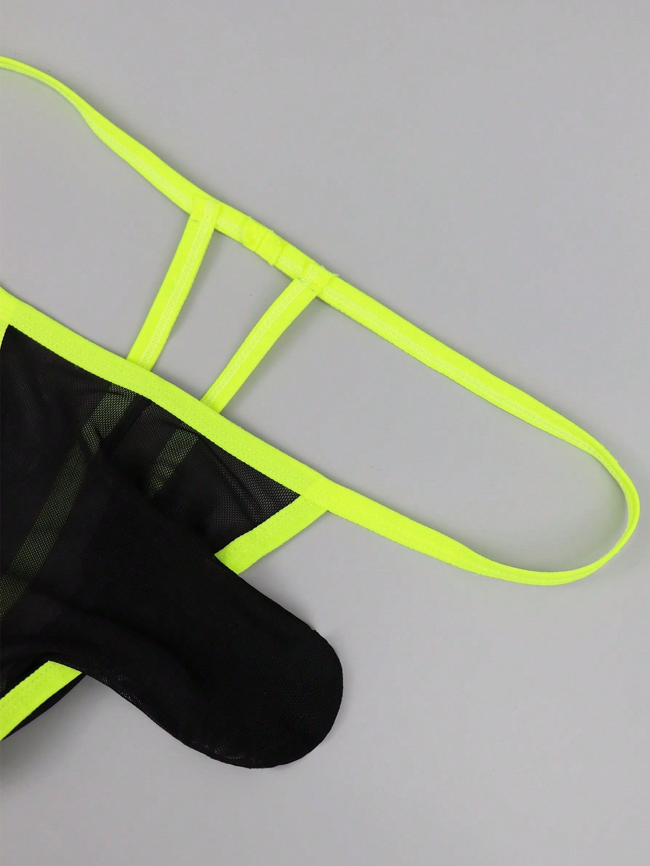 Men's black mesh jockstrap underwear with a plain design, U-convex pouch, and mid-rise fit.