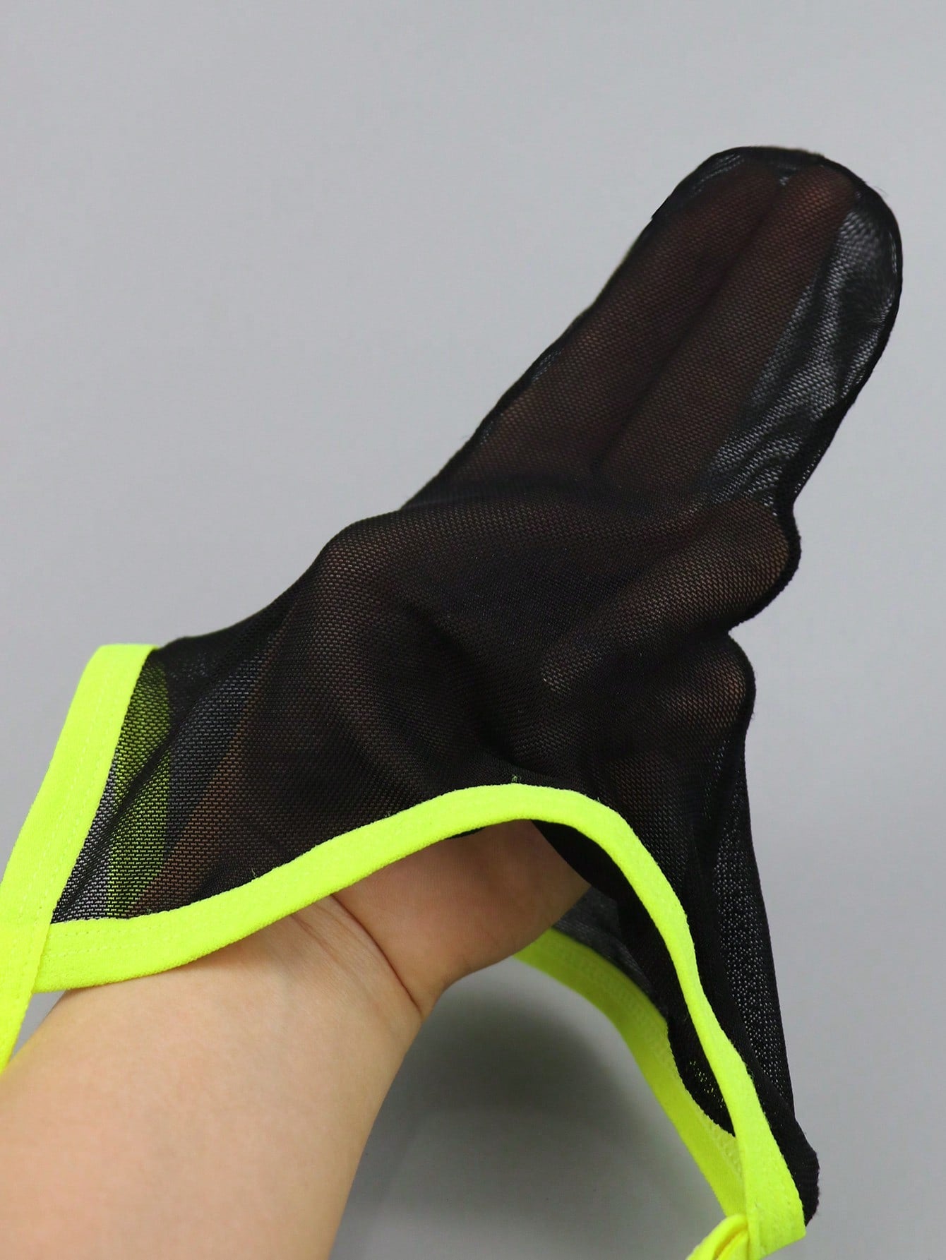 Men's black mesh jockstrap underwear with a plain design, U-convex pouch, and mid-rise fit.