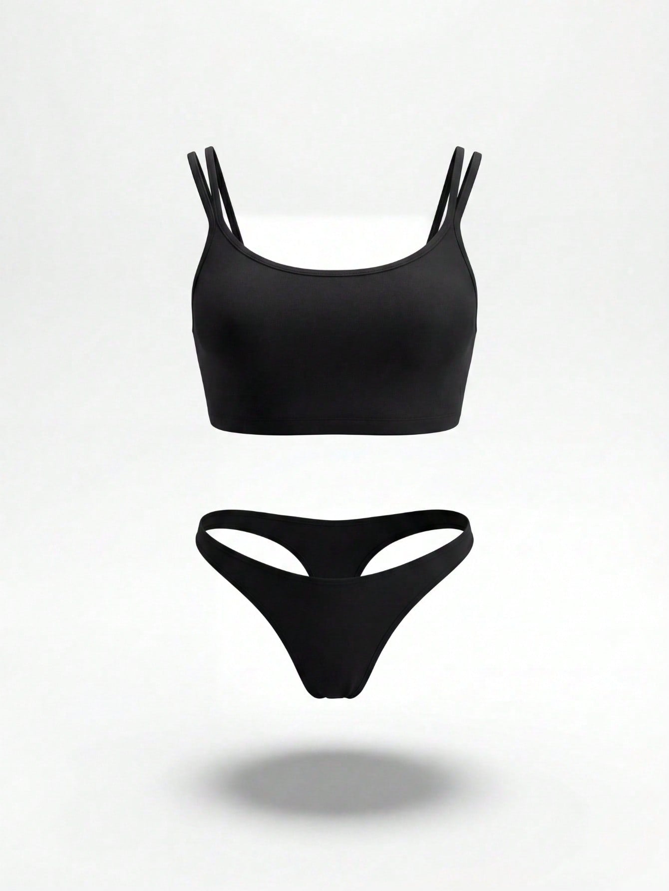 Plus size men's black suspender crop top and thong underwear set with a plain sleeveless short top, low rise fit, and medium stretch fabric.