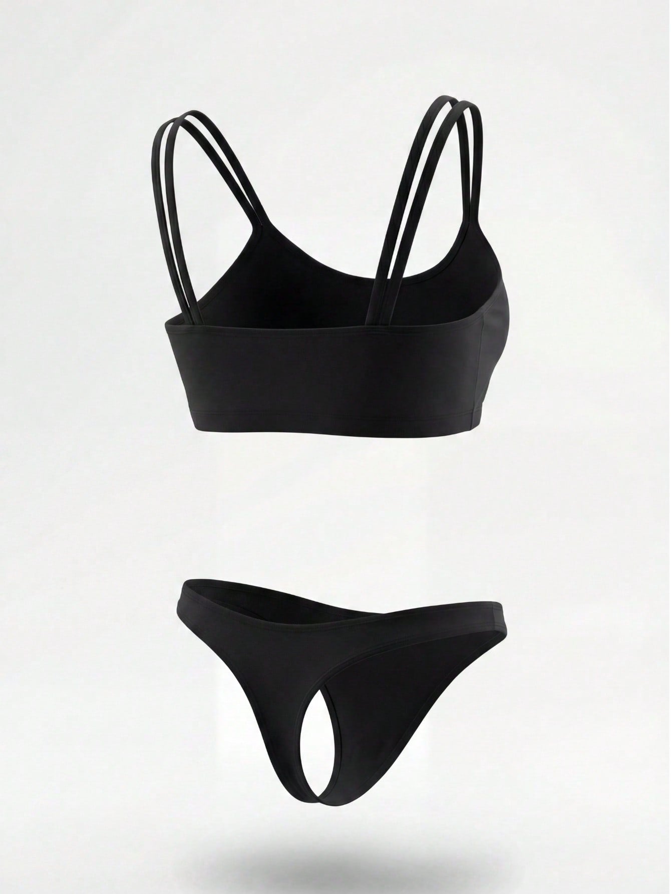 Plus size men's black suspender crop top and thong underwear set with a plain sleeveless short top, low rise fit, and medium stretch fabric.