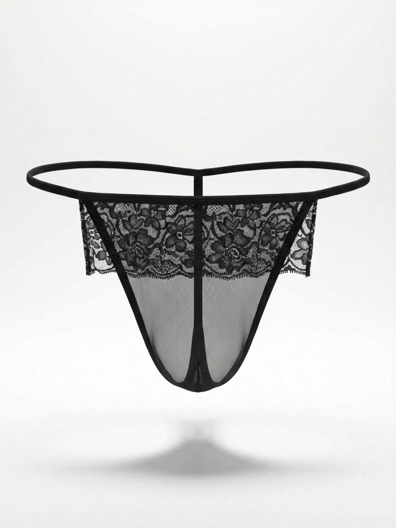 Men's black low-rise thong underwear in mesh fabric with contrast lace waistband and slim-fit design.