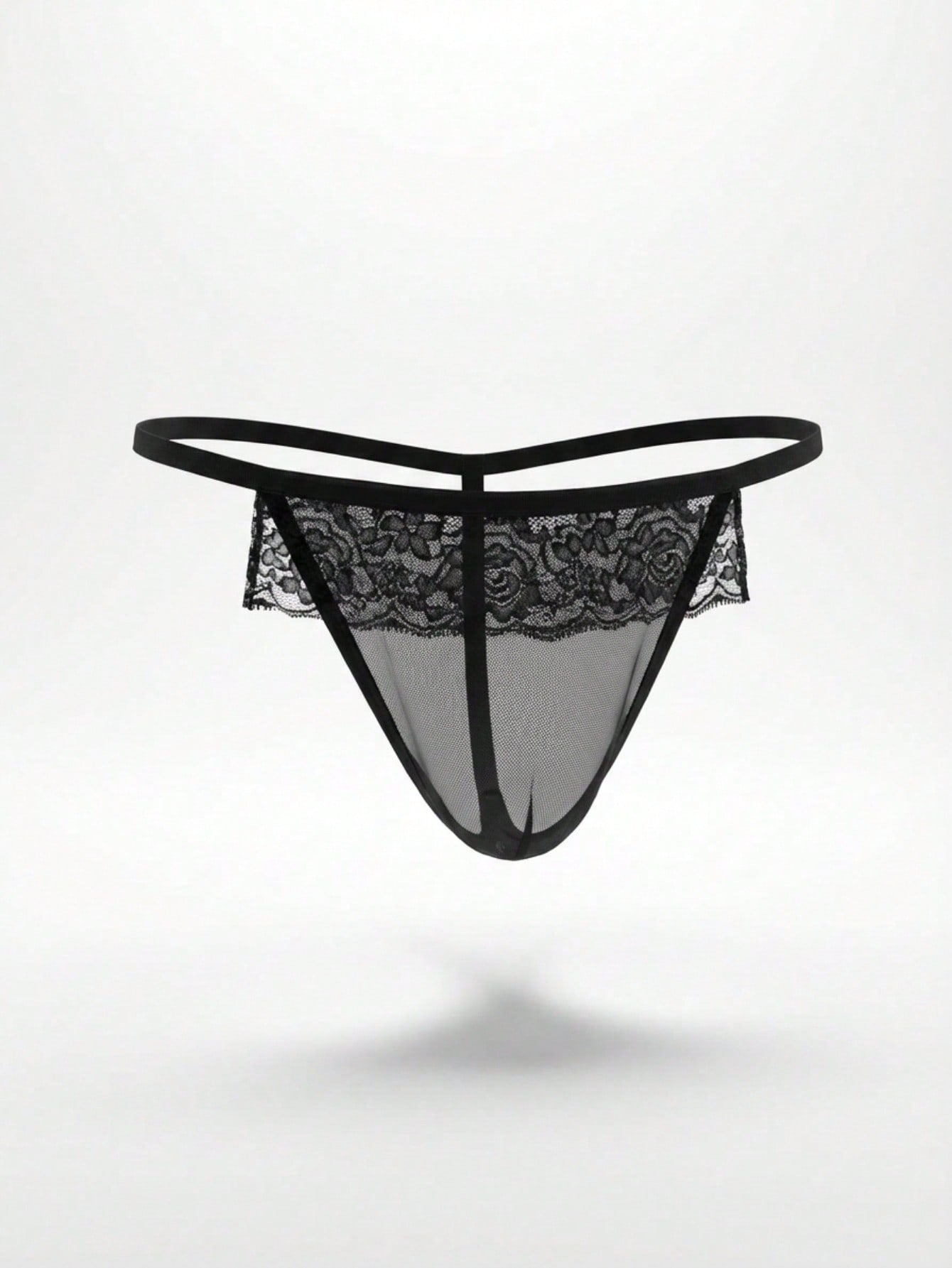 Men's black low-rise thong underwear in mesh fabric with contrast lace waistband and slim-fit design.