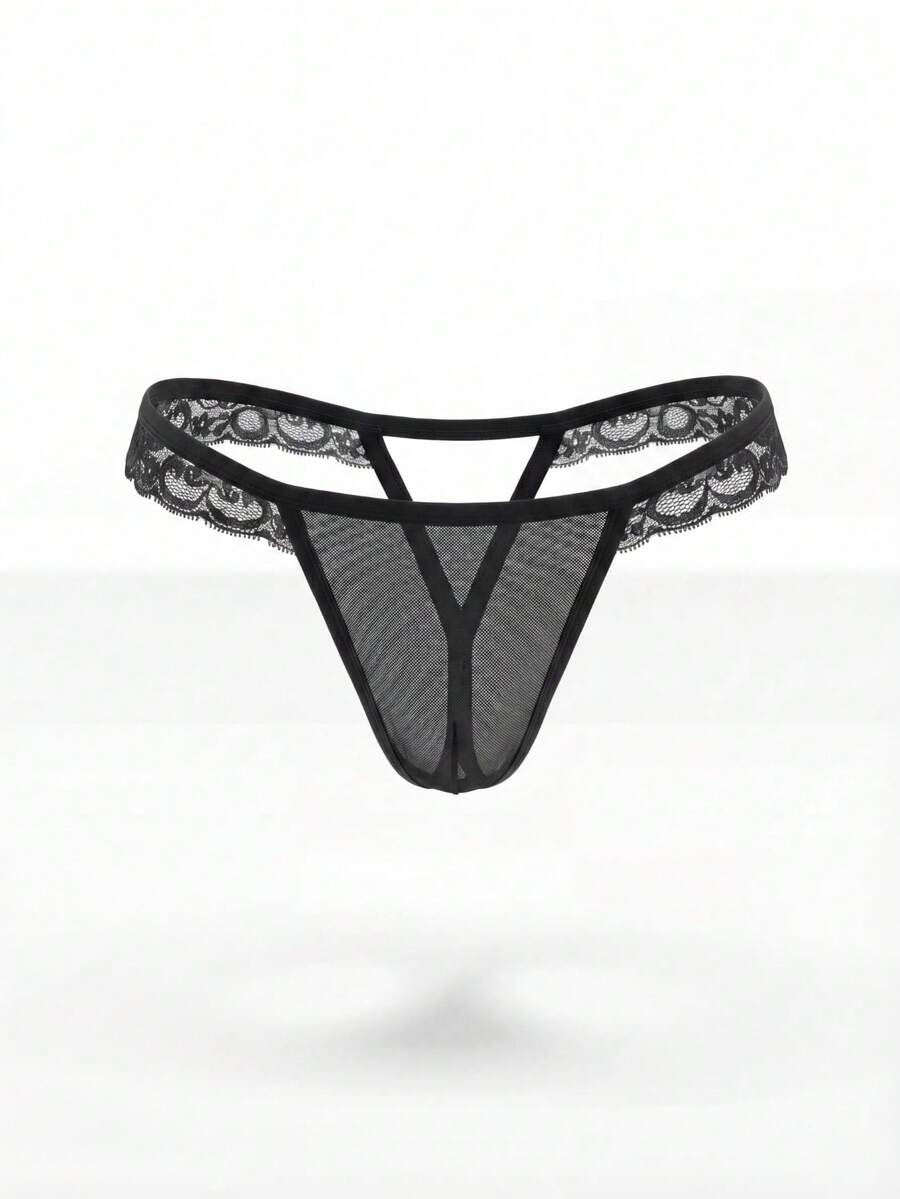 Black low rise men's thong with lace splice design and breathable mesh fabric.