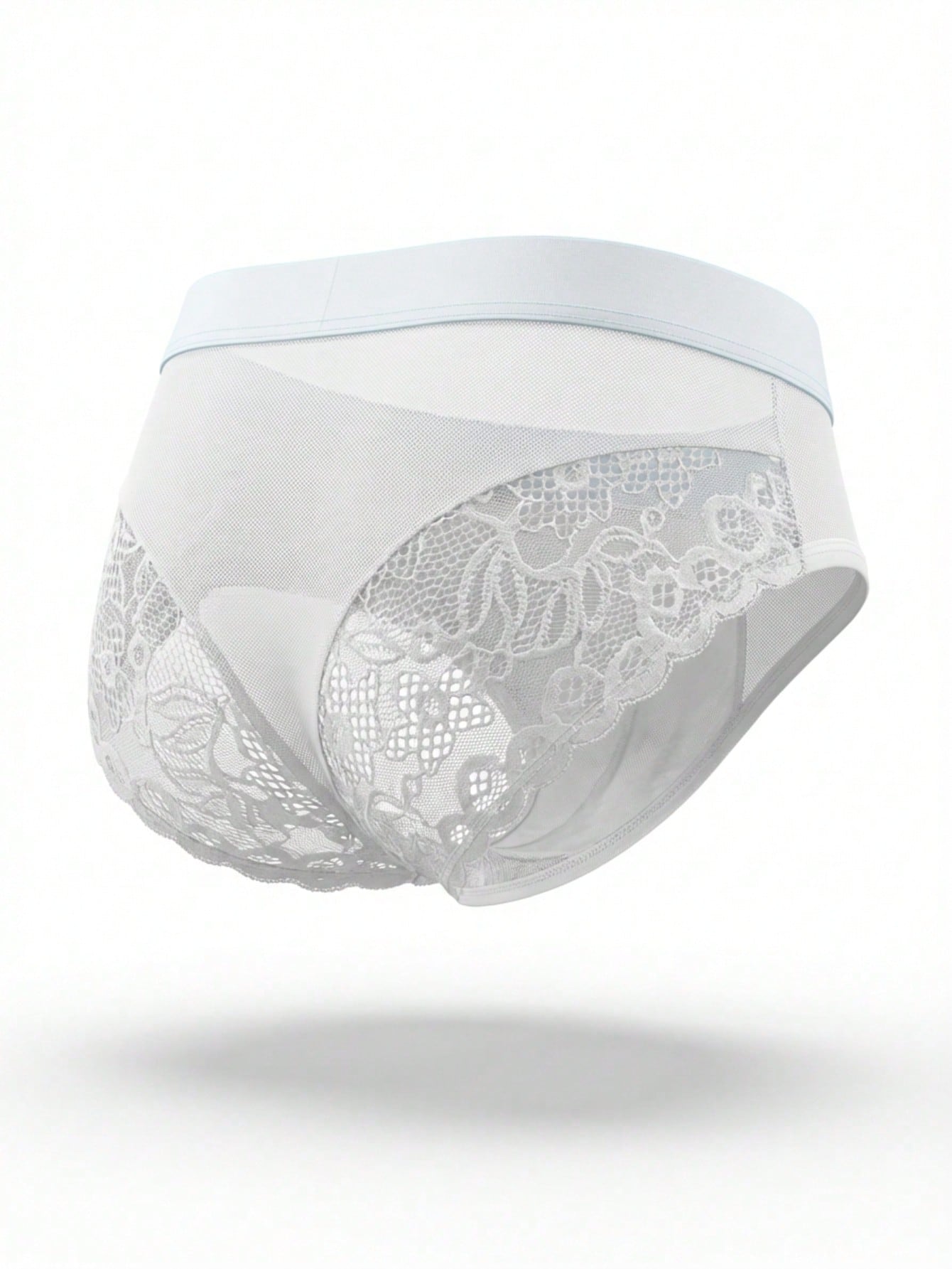 Men's low rise briefs with mesh and lace patchwork, plant pattern, and medium stretch fabric in red or white.