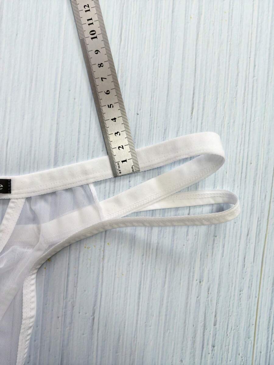Men's black mesh G-string thong underwear featuring a low-waist cut-out front design.
