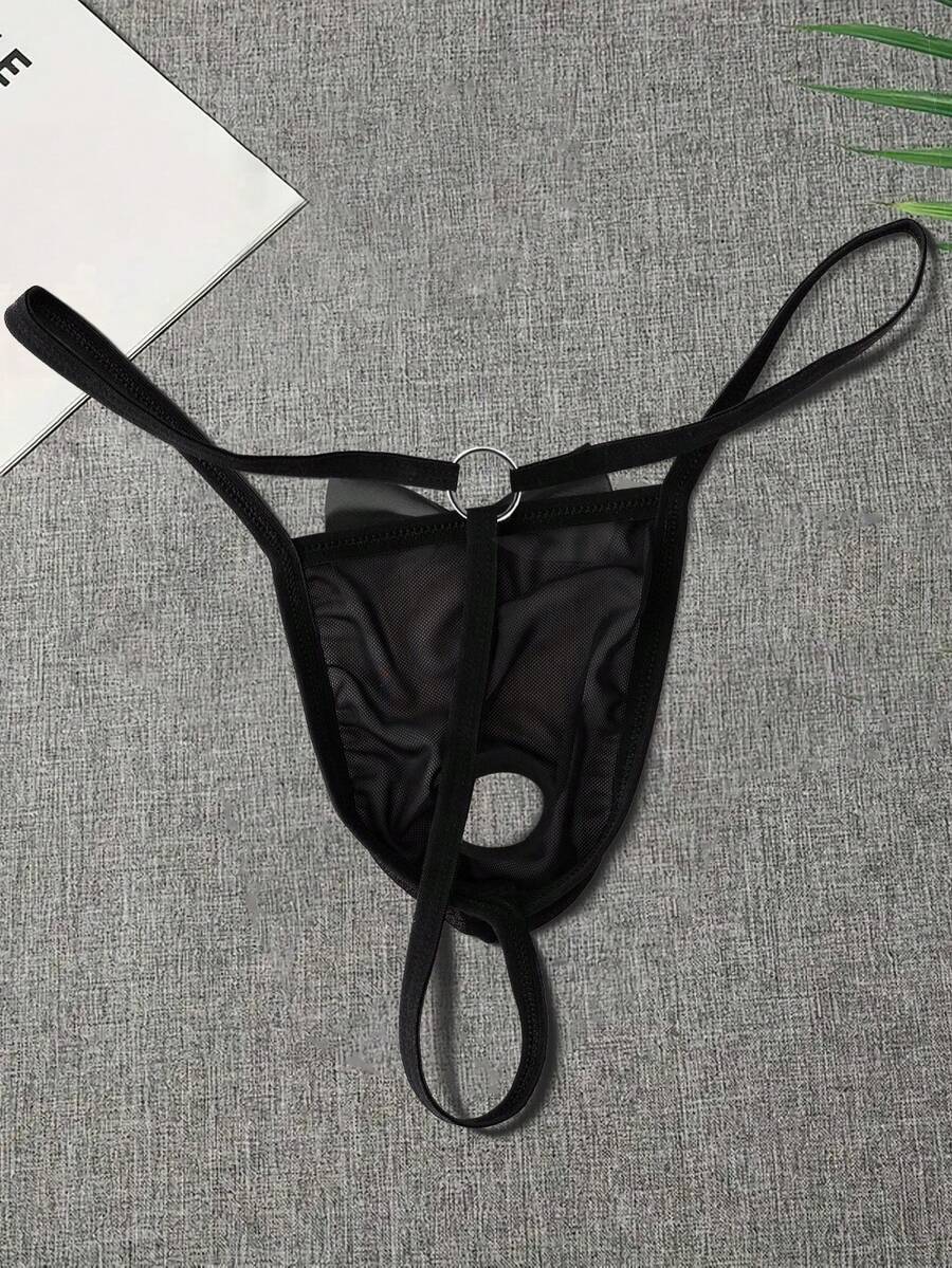 Black men's low rise open crotch G-string thong featuring letter print, bow decor, ring accent, and high stretch semi-sheer fabric.