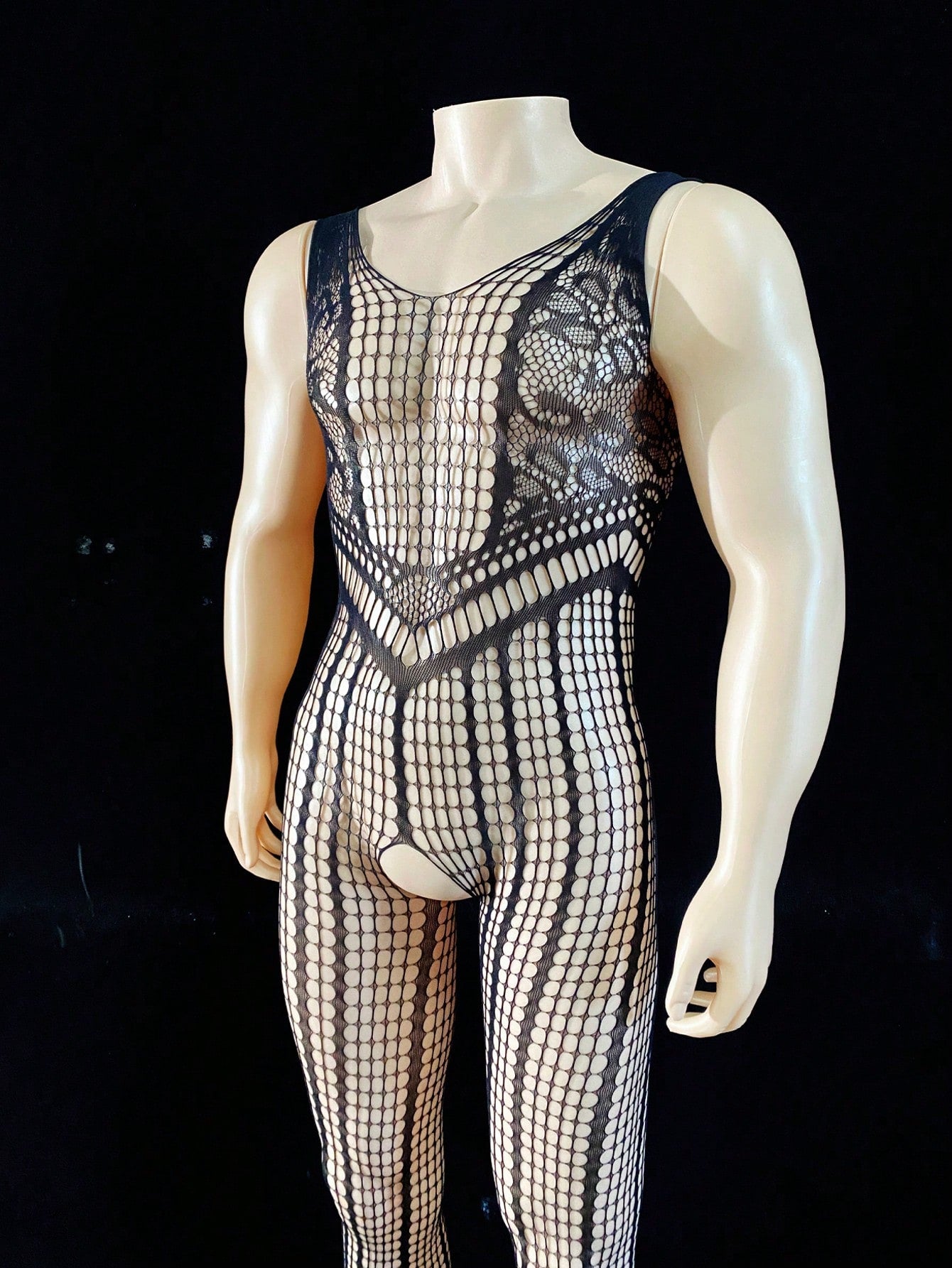 Black men's sheer bodysuit with cut-out design, plaid pattern, round neck, short length, and high-stretch polyamide elastane fabric.