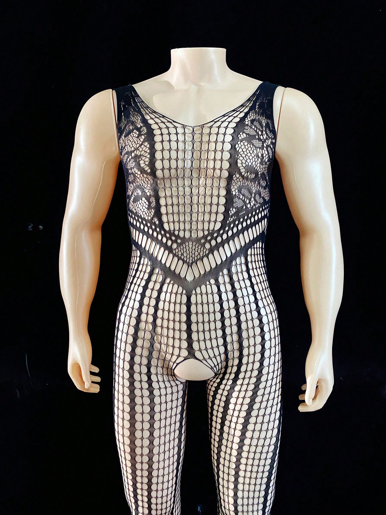 Black men's sheer bodysuit with cut-out design, plaid pattern, round neck, short length, and high-stretch polyamide elastane fabric.