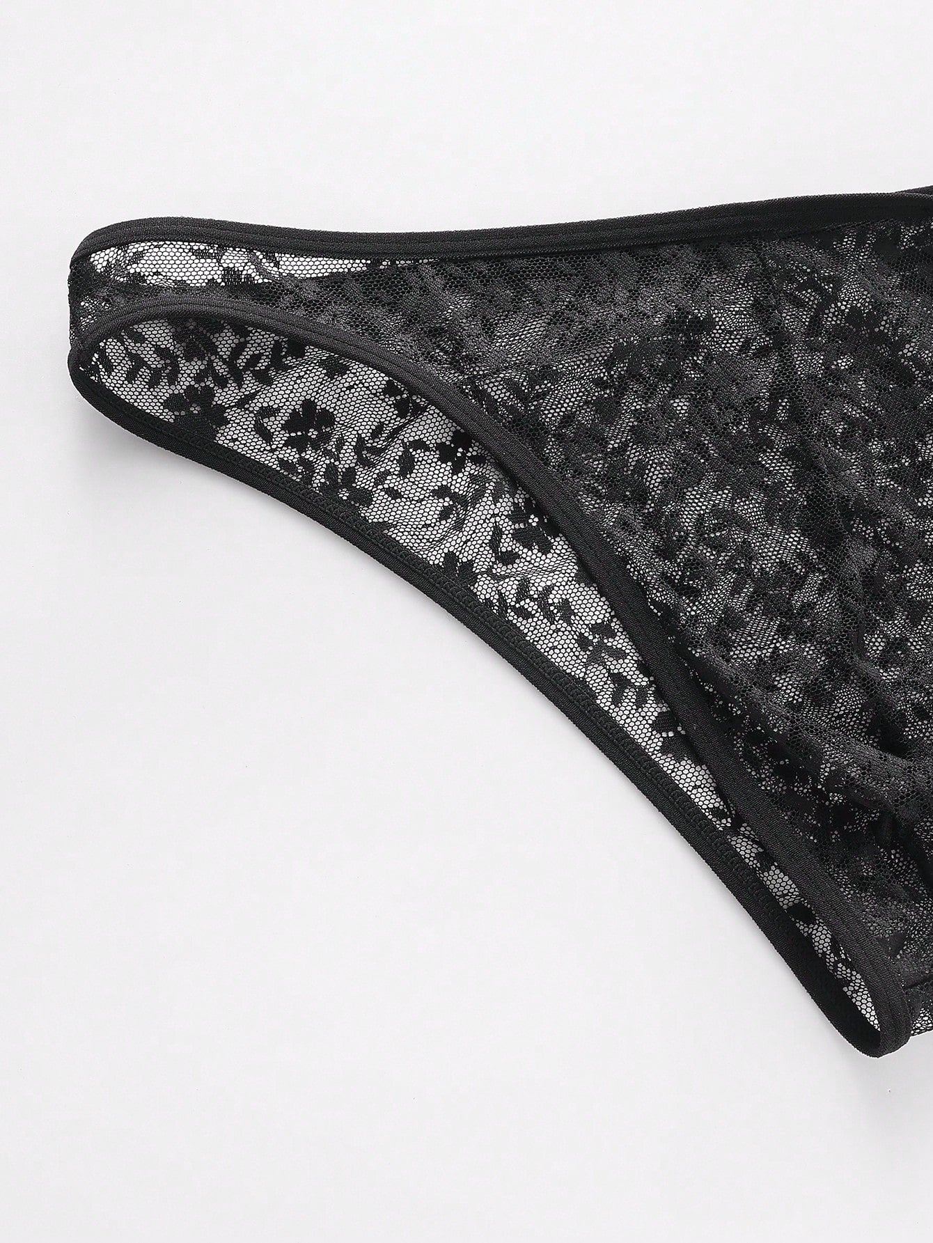 Men's black lace semi-sheer thong briefs with low rise fit and medium stretch fabric