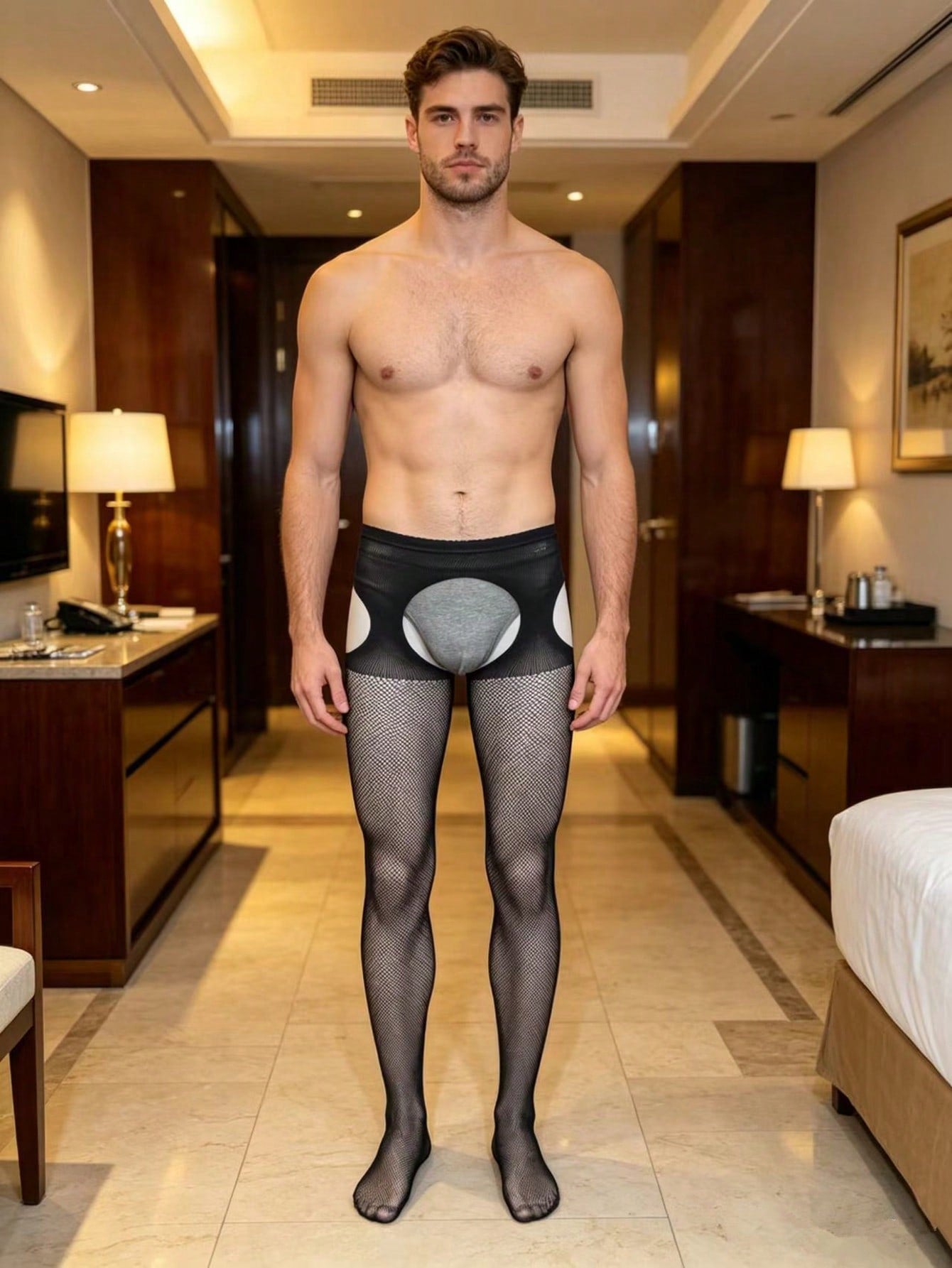 Black sheer fishnet bodystocking for men in high-stretch knitted polyamide with a low-rise thong design and plain pattern.