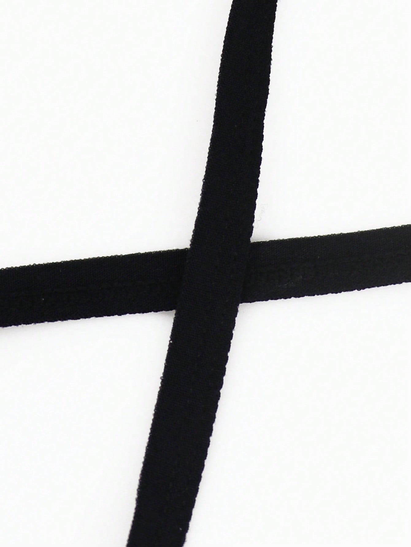 Black men's low-rise thong underwear made from breathable knitted fabric with medium stretch and a plain opaque design.