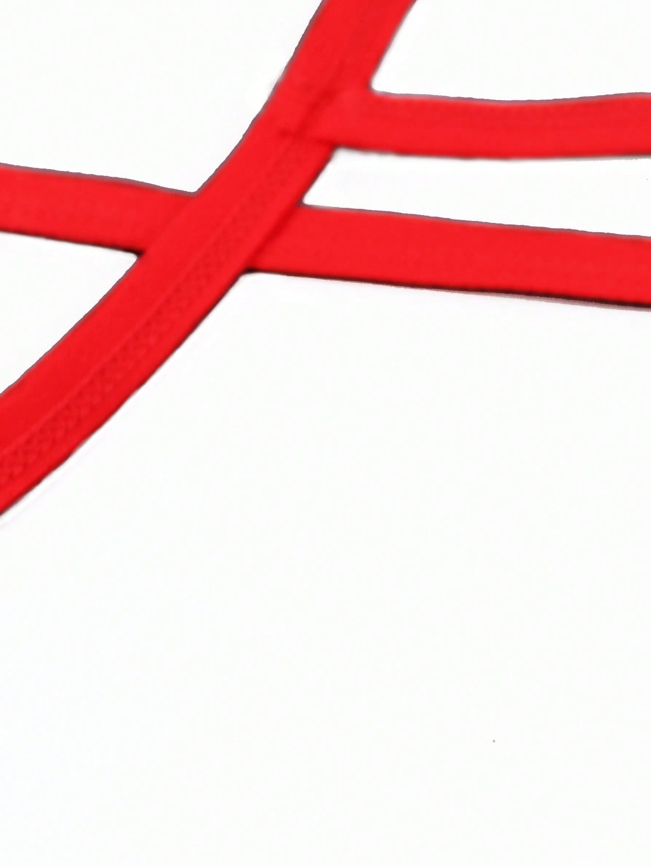 Red men's low rise thong underwear with contrast lace trim, letter pattern, and medium-stretch knitted fabric in 97% polyamide and 3% elastane.
