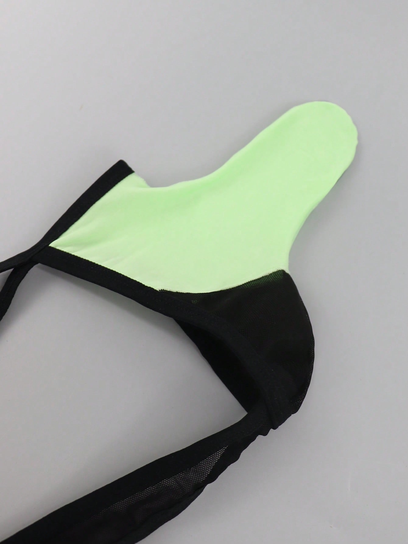 Men's multicolor mesh thong underwear with a plain design and mid-rise fit, made from stretchy polyester and elastane blend.