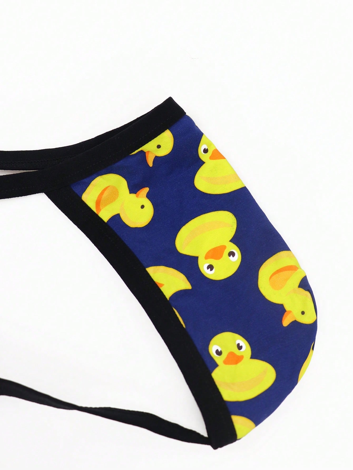 Men's seamless low-rise thong underwear in knitted viscose blend with medium stretch and geometric letter print.