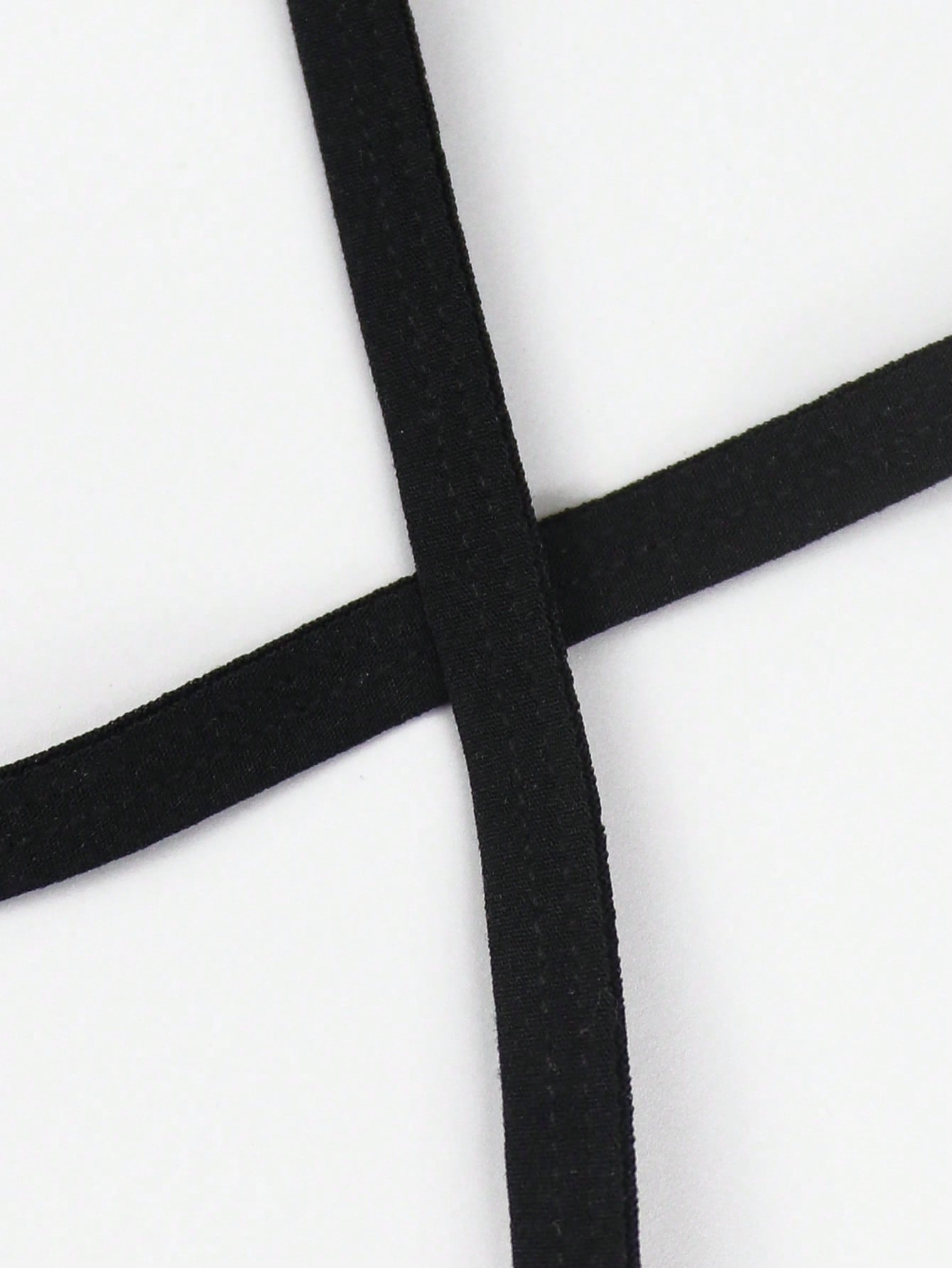 Black men's colorblock thong underwear in knitted fabric with a low rise fit and medium stretch.