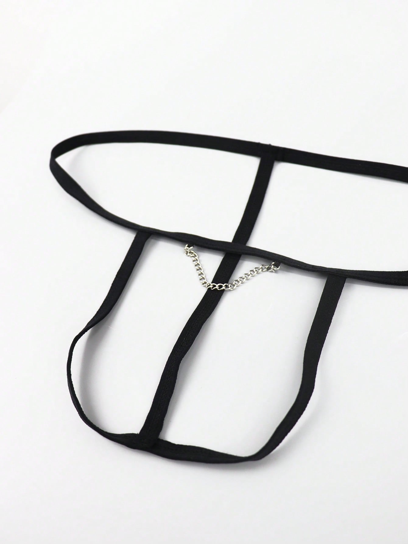 Black men's colorblock thong underwear in knitted fabric with a low rise fit and medium stretch.