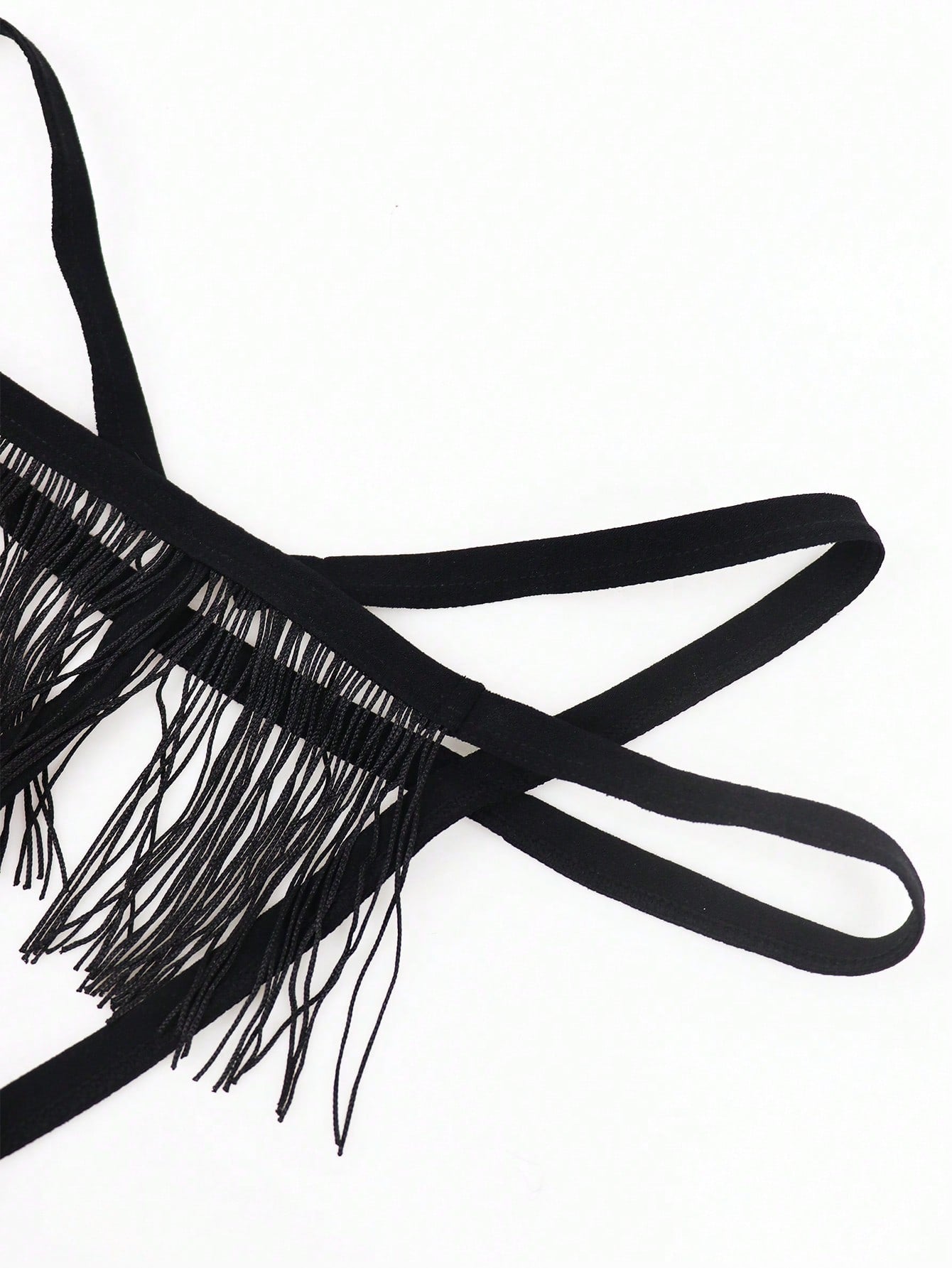 Black men's thong underwear with a low-rise waist, plain design, and knitted stretch fabric.