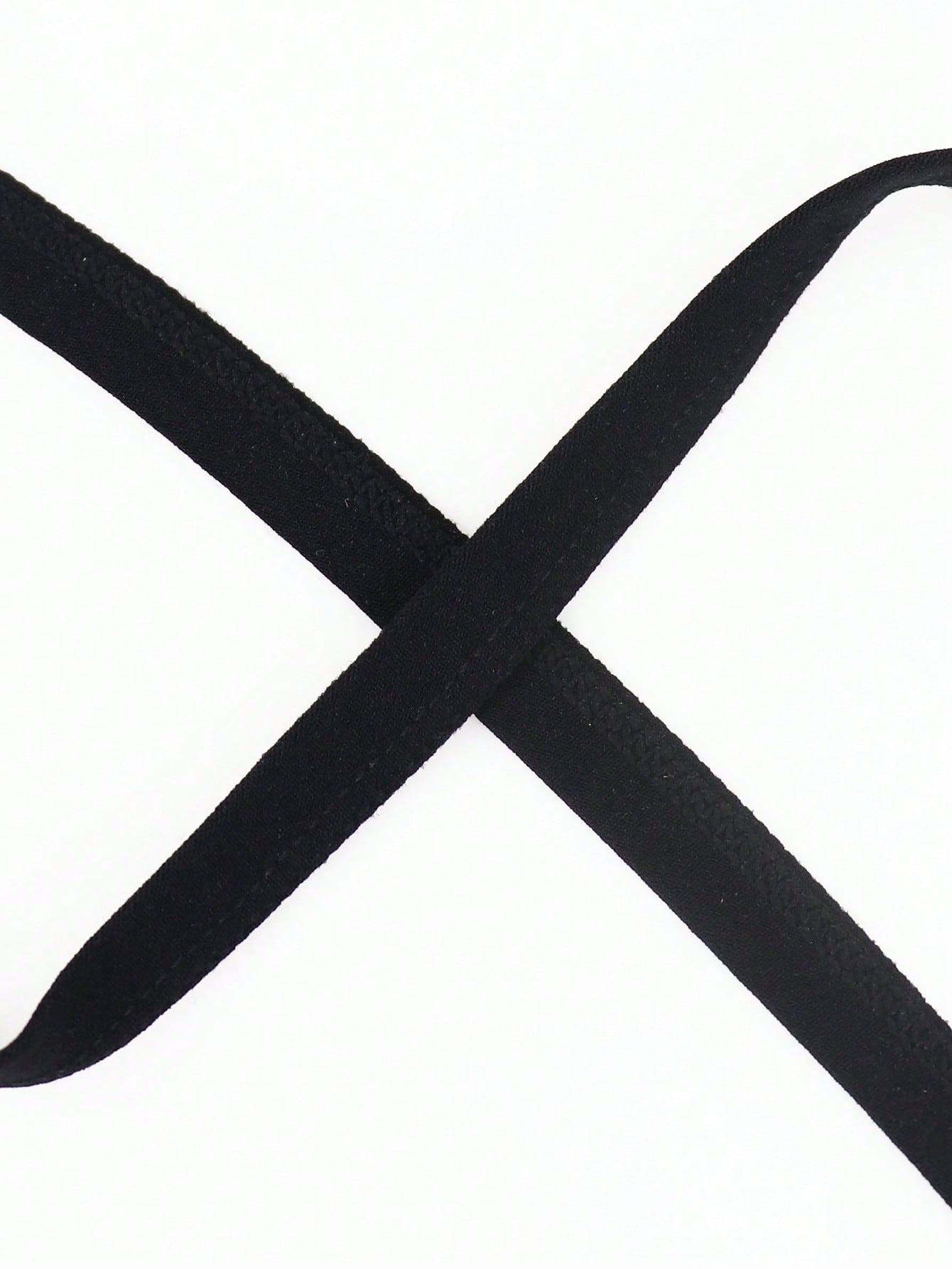 Black men's thong underwear with fringe detail, mid-rise fit, plain design, and knitted fabric construction.
