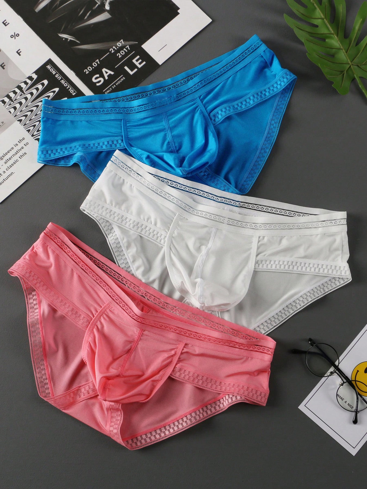 3-pack of men's low rise triangle briefs in assorted random colors made from breathable quick-drying fabric.