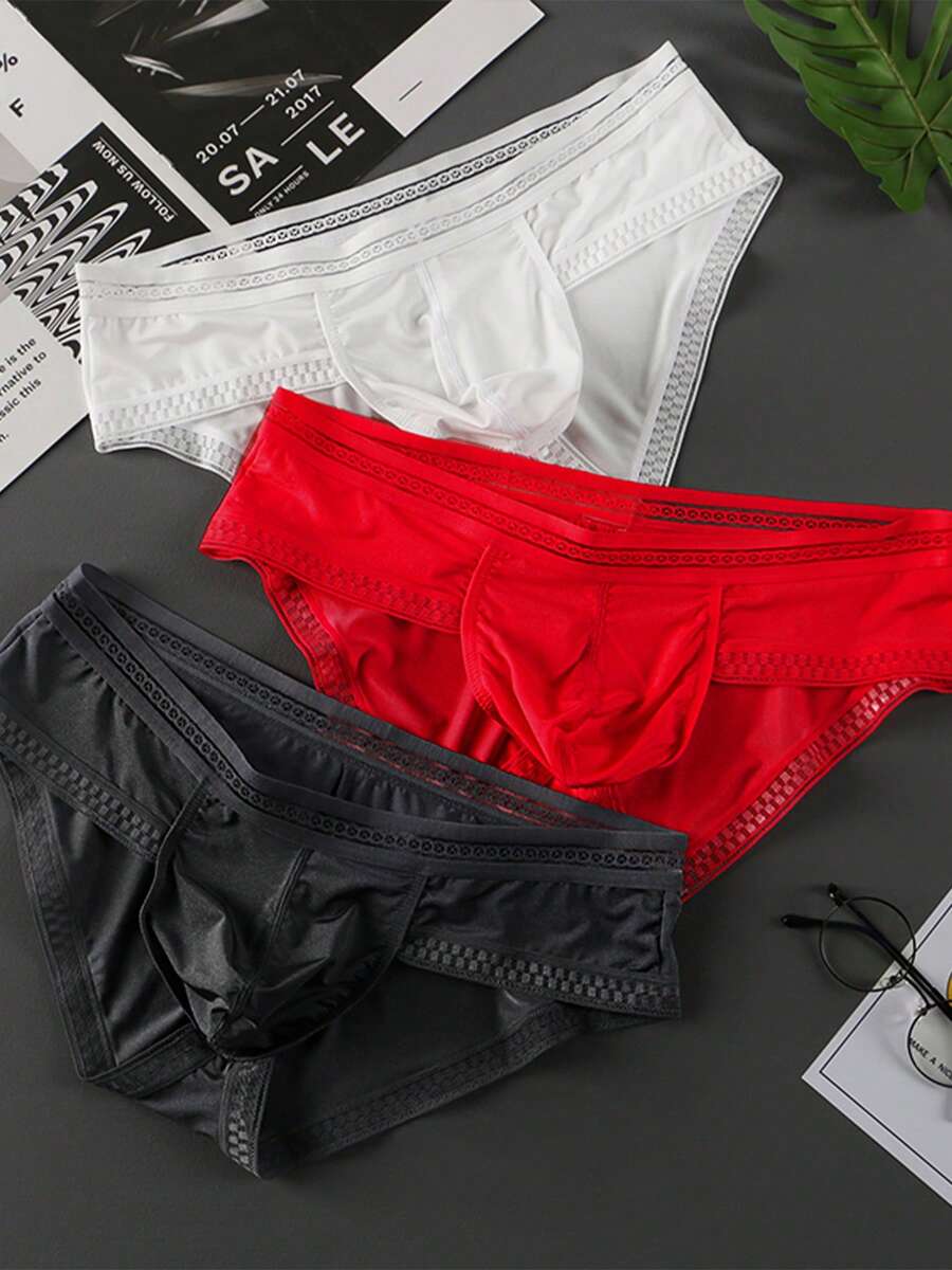 3-pack of men's low rise triangle briefs in assorted random colors made from breathable quick-drying fabric.