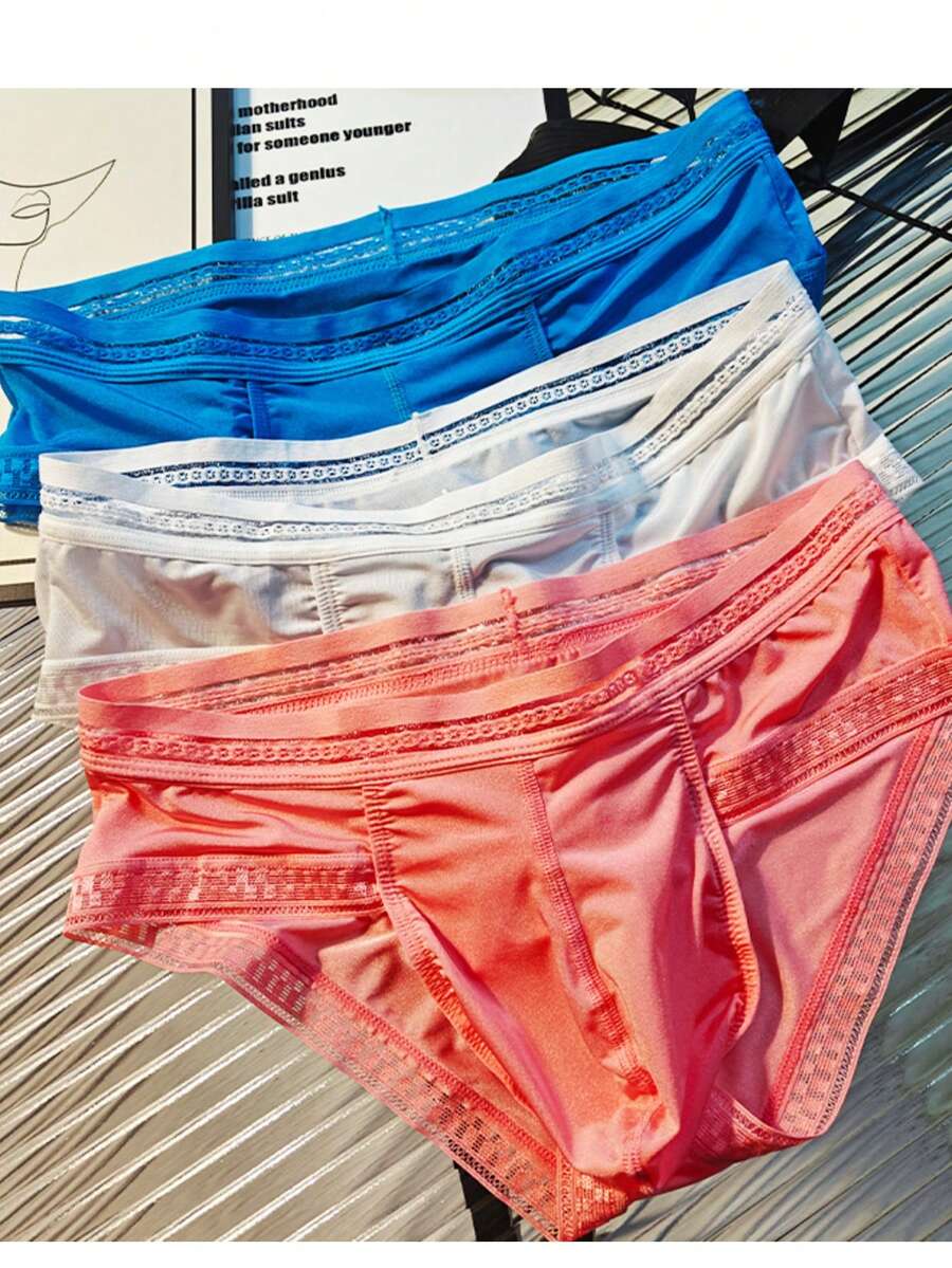 3-pack of men's low rise triangle briefs in assorted random colors made from breathable quick-drying fabric.