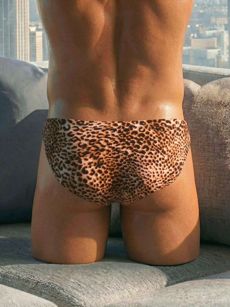Men's low rise leopard print triangle briefs in multicolor featuring a geometric textured pattern.