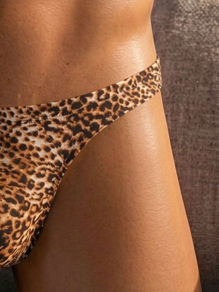 Men's low rise leopard print triangle briefs in multicolor featuring a geometric textured pattern.