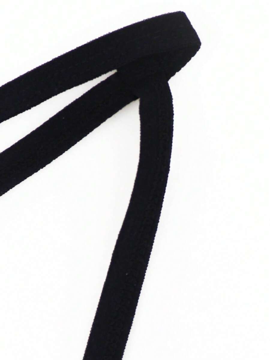 Red low-rise men's mesh thong underwear featuring a colorblock letter waistband and bulge-enhancing front pouch.