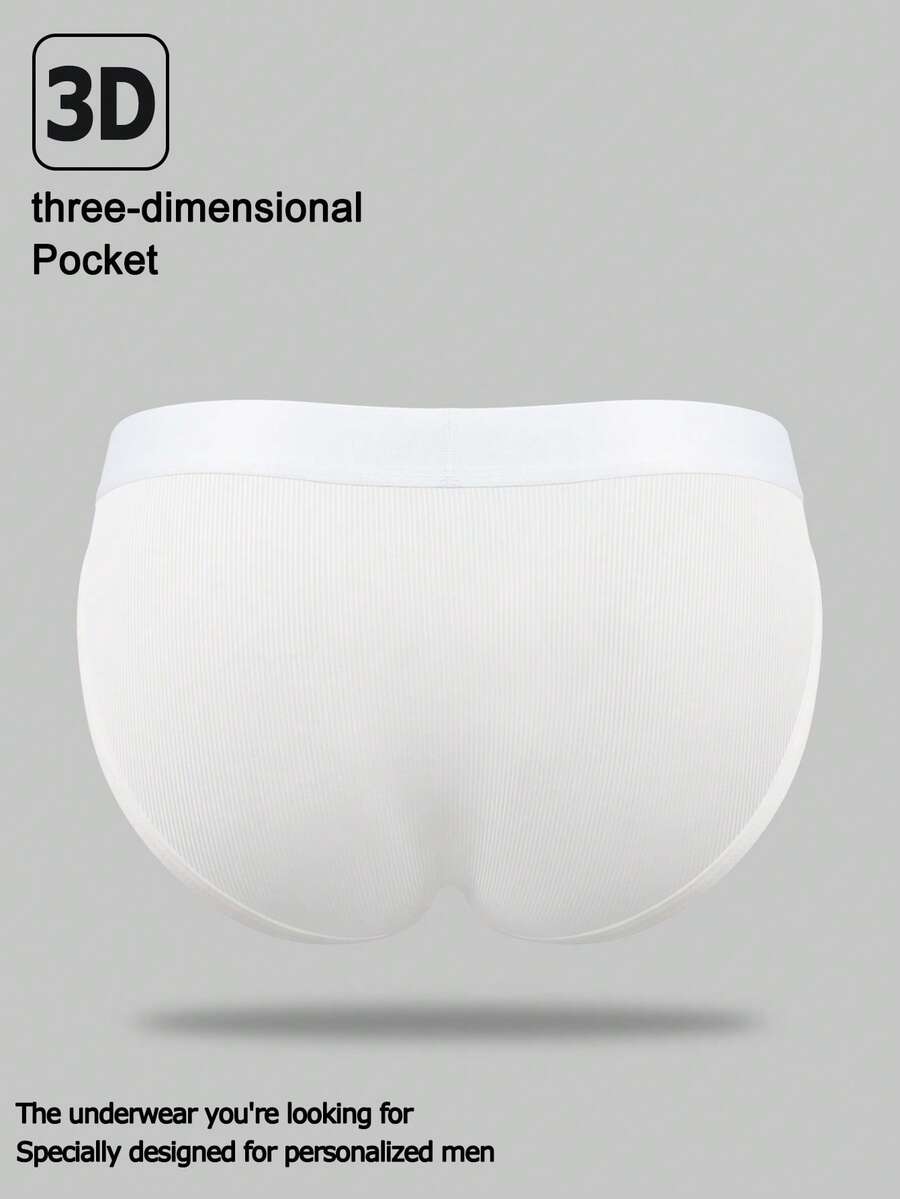 Men's black low-rise thong underwear with a ring-connected hollow design in knitted stretch fabric.