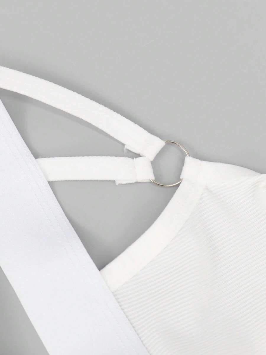 Men's black low-rise thong underwear with a ring-connected hollow design in knitted stretch fabric.