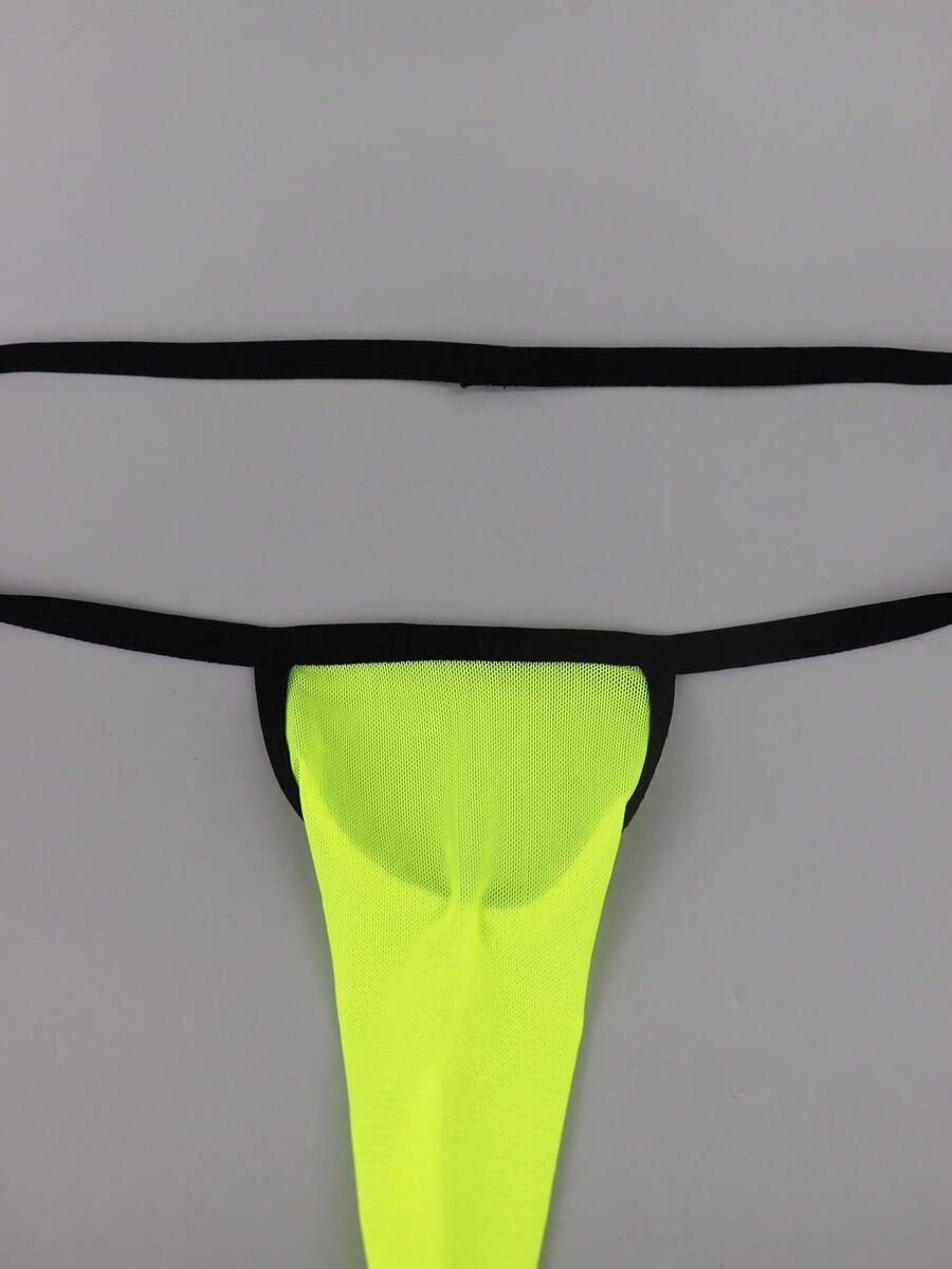Yellow mesh jockstrap for men with a mid-rise waist, hollow U-convex pouch design, and breathable stretch polyamide fabric.