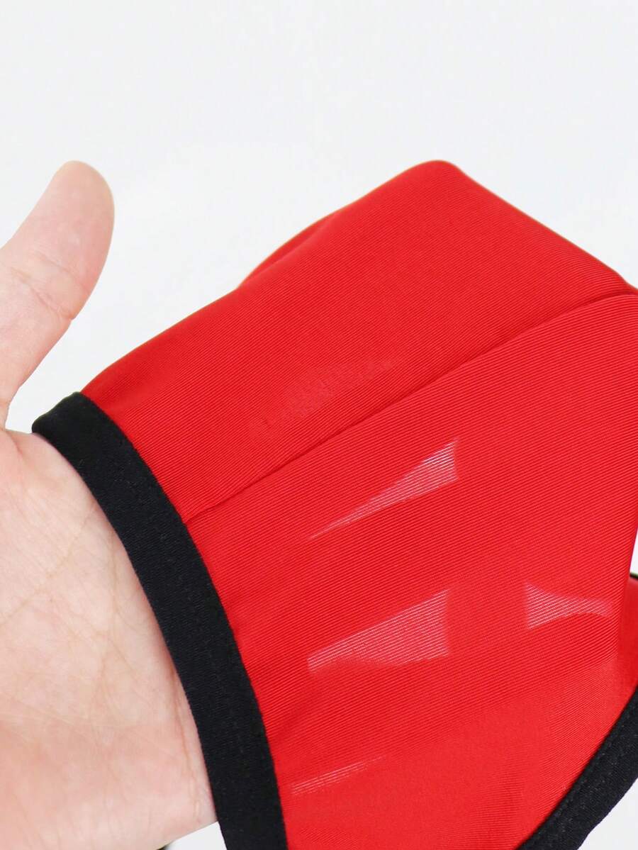 Red men's low-rise jockstrap underwear featuring criss-cross cut-out details in medium stretch knitted fabric.