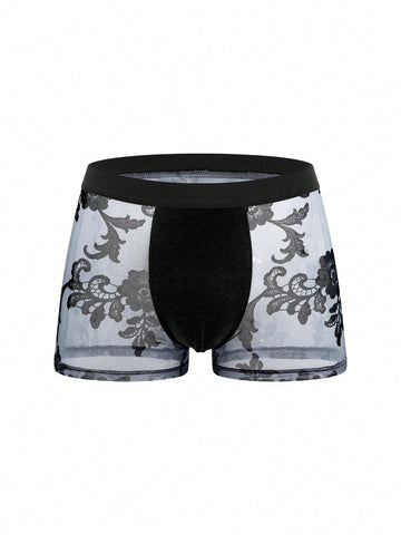 Black mid-rise men's boxer briefs featuring contrast binding and semi-sheer high-stretch fabric with a Halloween pattern.