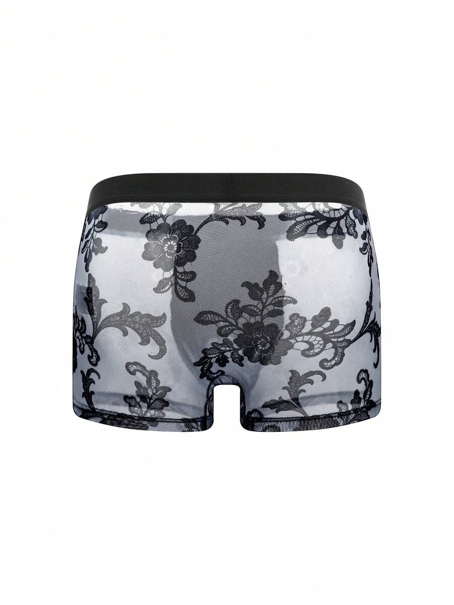Black mid-rise men's boxer briefs featuring contrast binding and semi-sheer high-stretch fabric with a Halloween pattern.