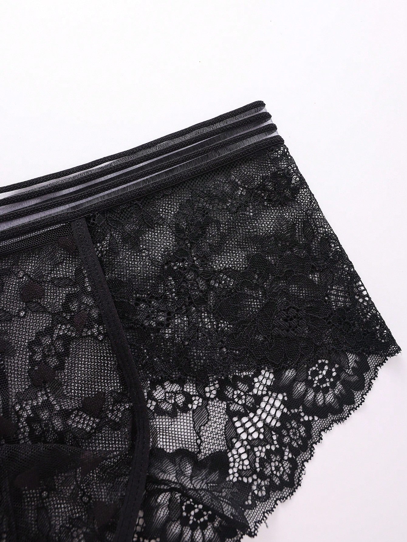 Three-pack men's lace briefs in multicolor with geometric pattern, semi-sheer finish, mid-rise cut, and medium-stretch knitted fabric.