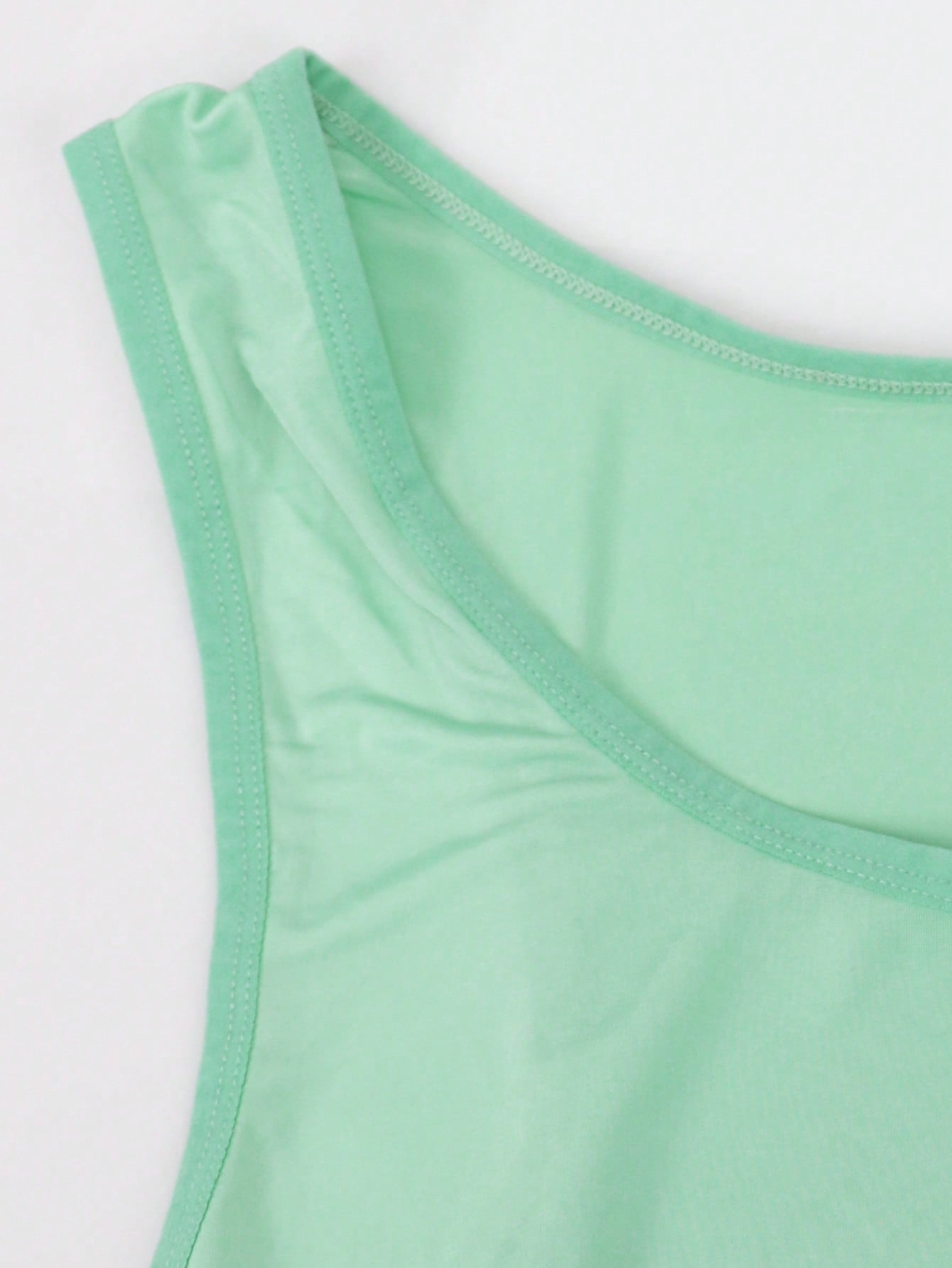 Men's plain sleeveless shapewear bodysuit in knitted fabric with short length and medium stretch, designed for waist support and home wear.